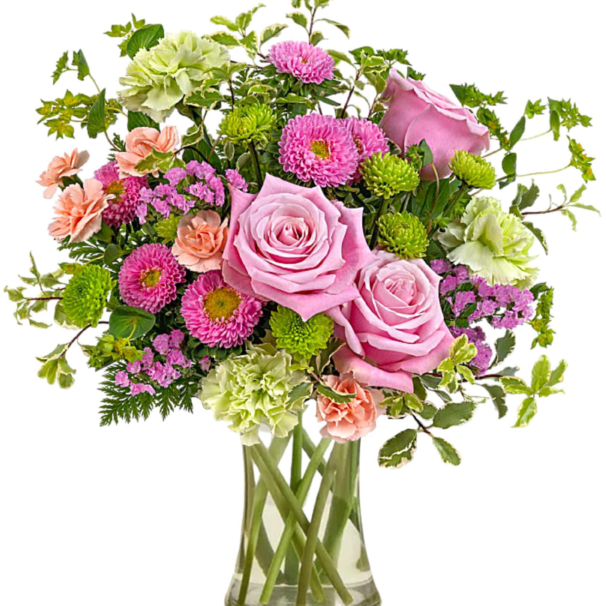 Pink roses and mixed flowers in a clear glass vase