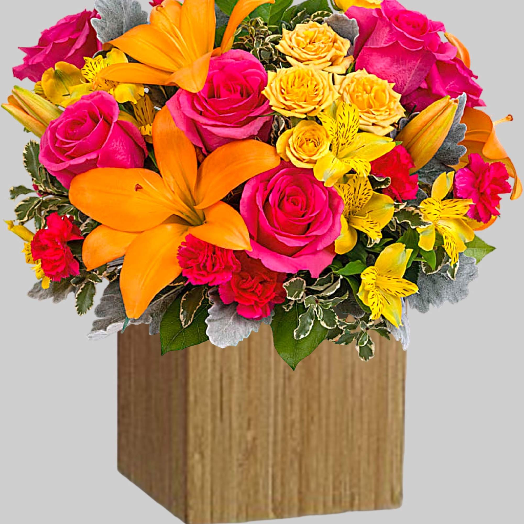 Bright bouquet of pink roses, orange lilies, and yellow flowers in a wooden cube vase, photo 4 of 4
