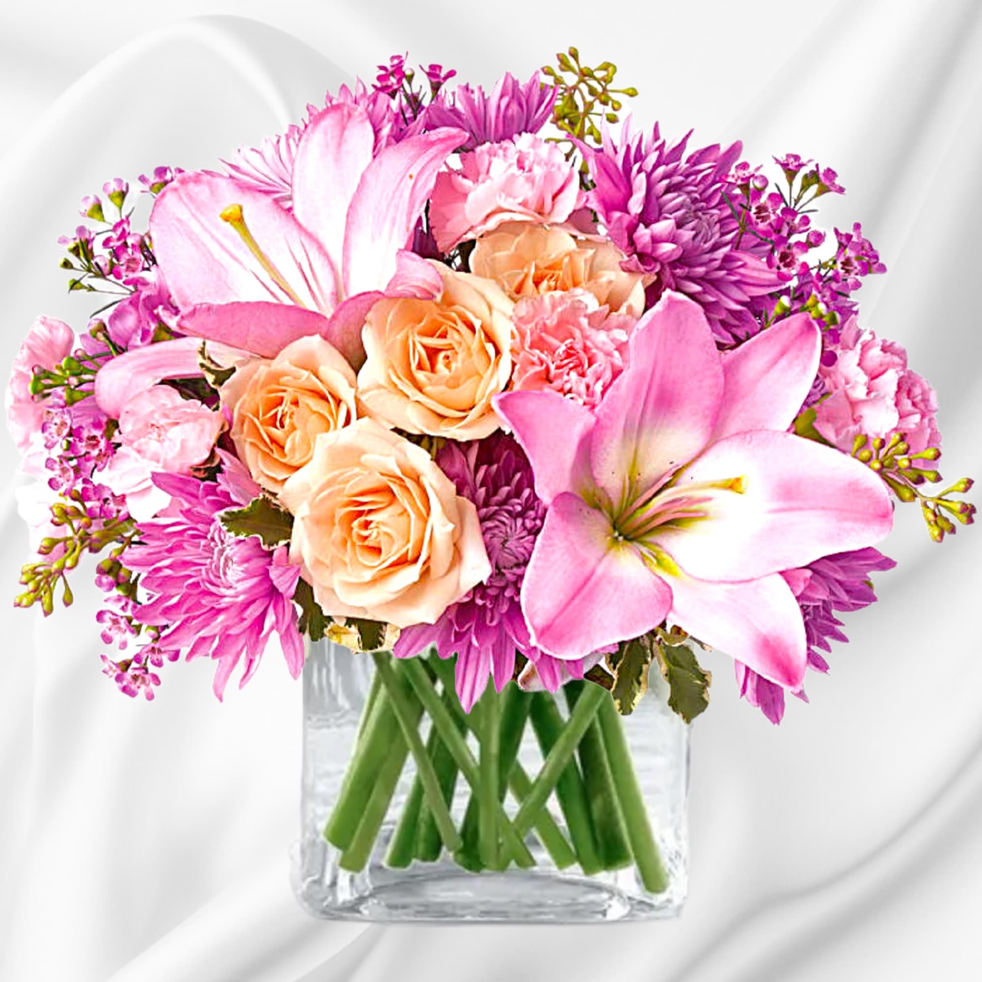 Pink and peach mixed bouquet in a clear glass vase, photo 4 of 5