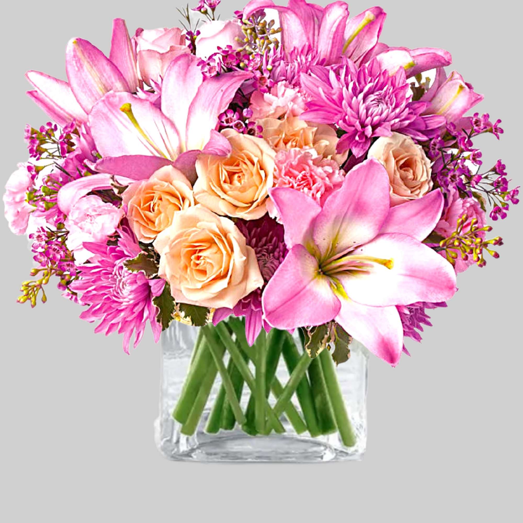 Pink lilies and peach roses in a clear glass vase, photo 5 of 5