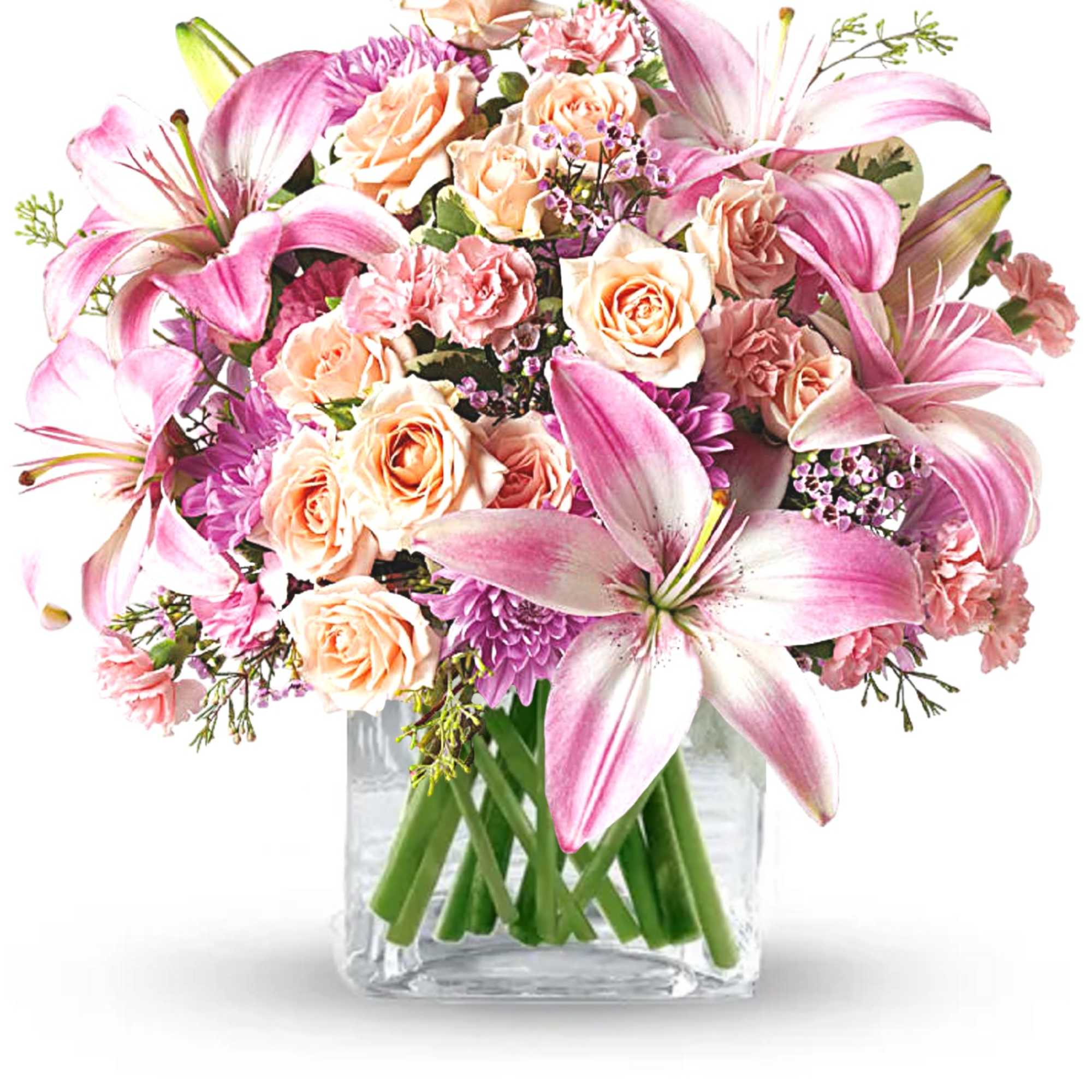 Pink lilies and peach roses arranged in a clear glass vase