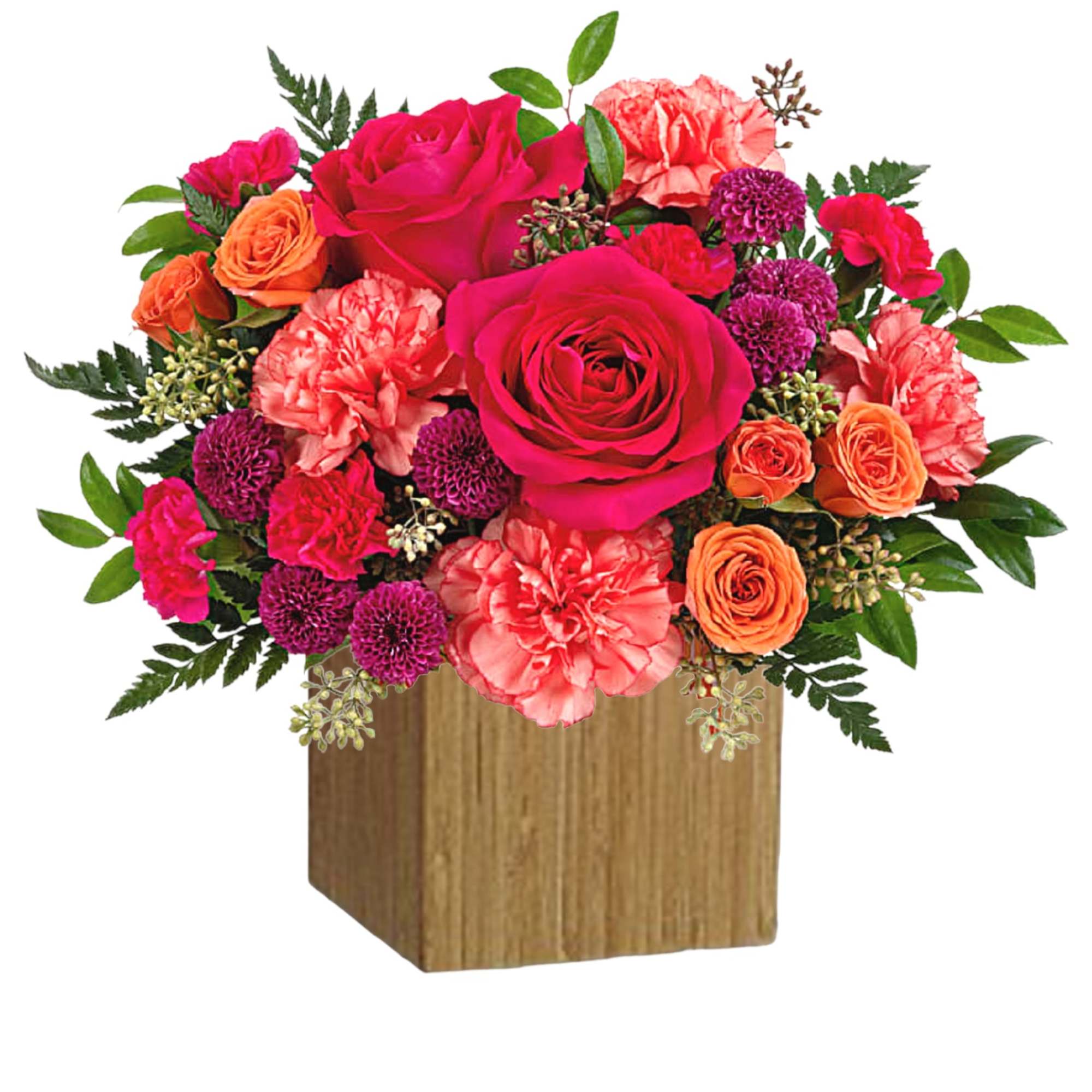 Bright mixed bouquet of roses and carnations in a wooden cube vase