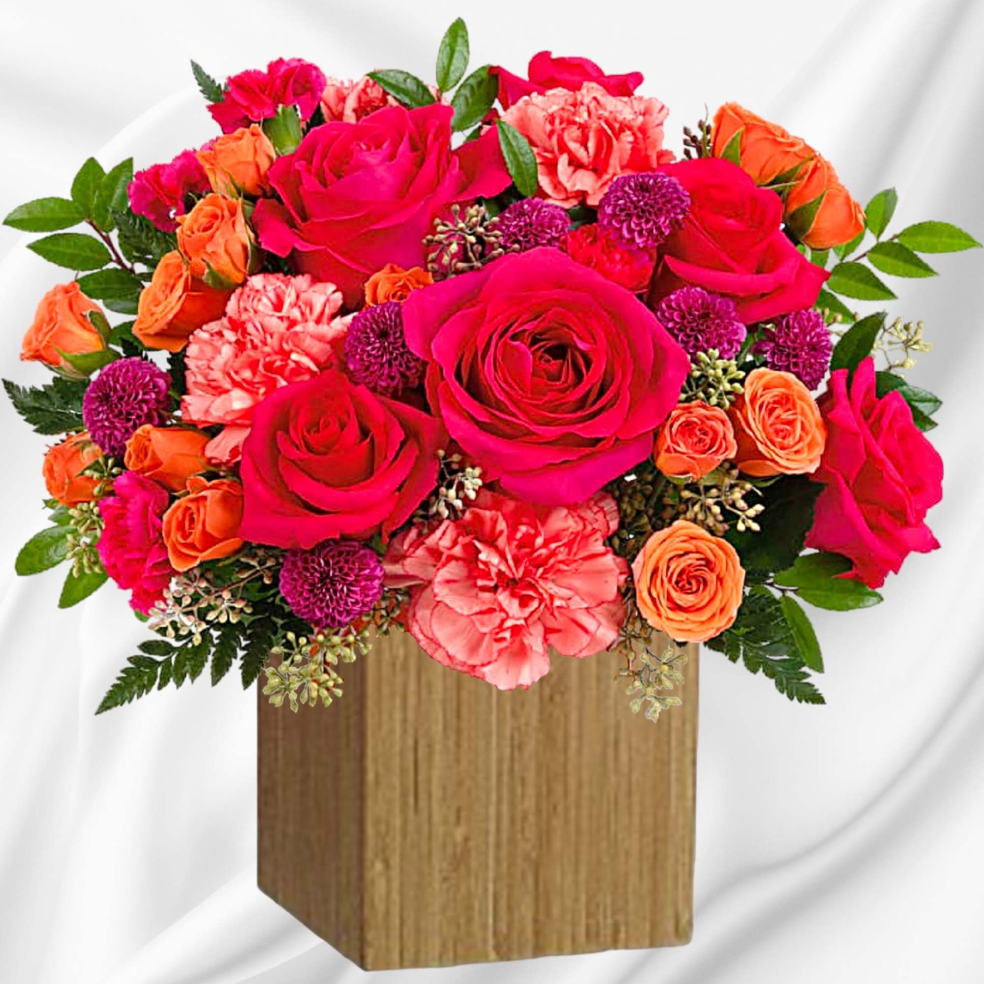 Bright pink and orange flower arrangement in a wooden box, photo 2 of 4