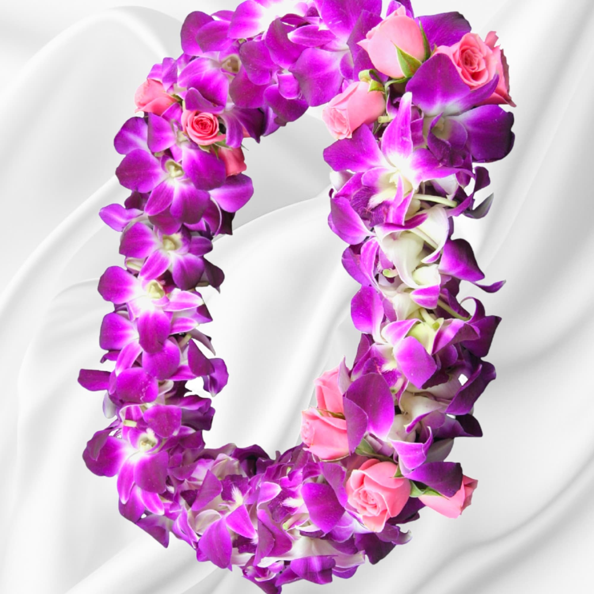 Purple orchid and pink rose floral wreath on white fabric
