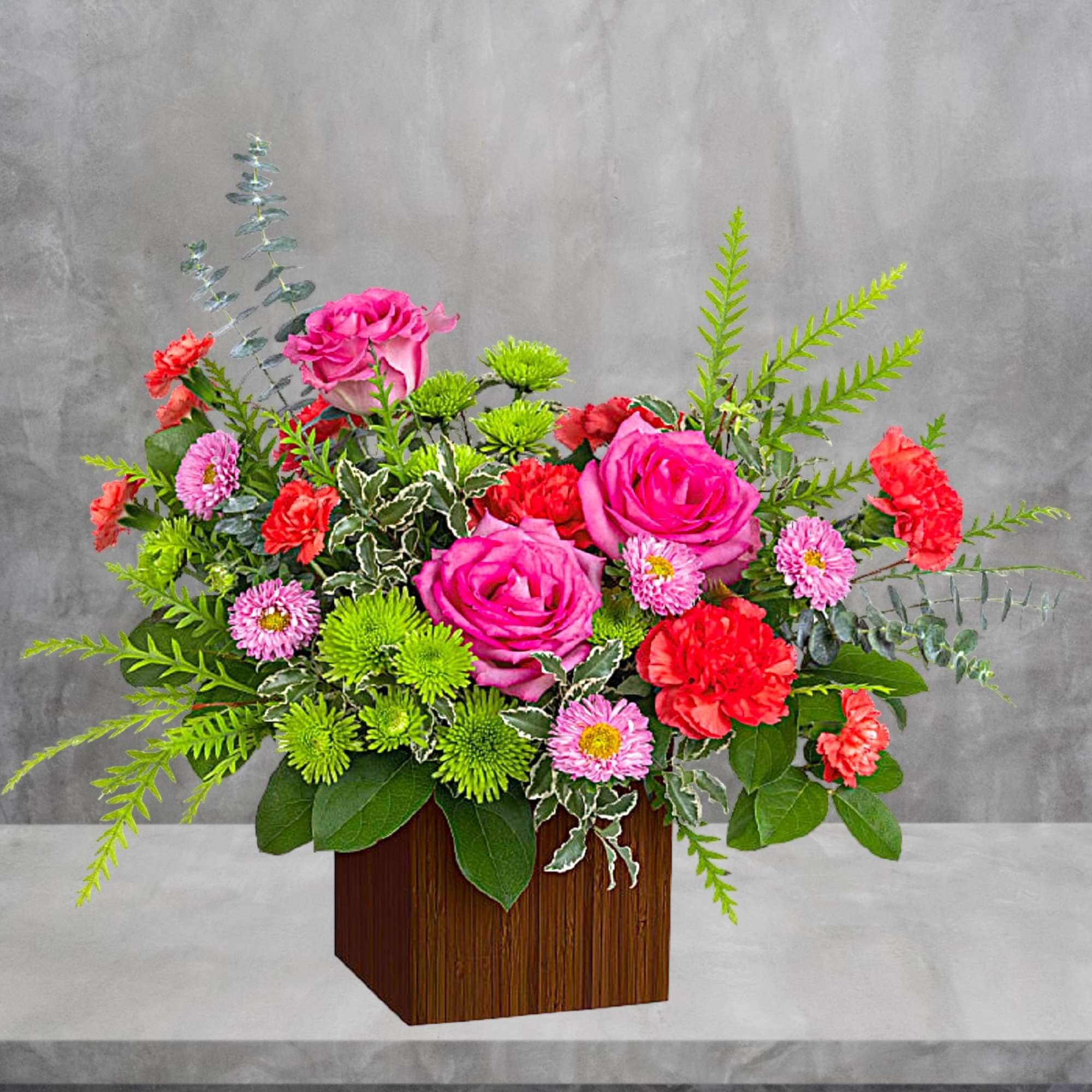 Pink roses and red carnations in a wooden cube vase, photo 3 of 4