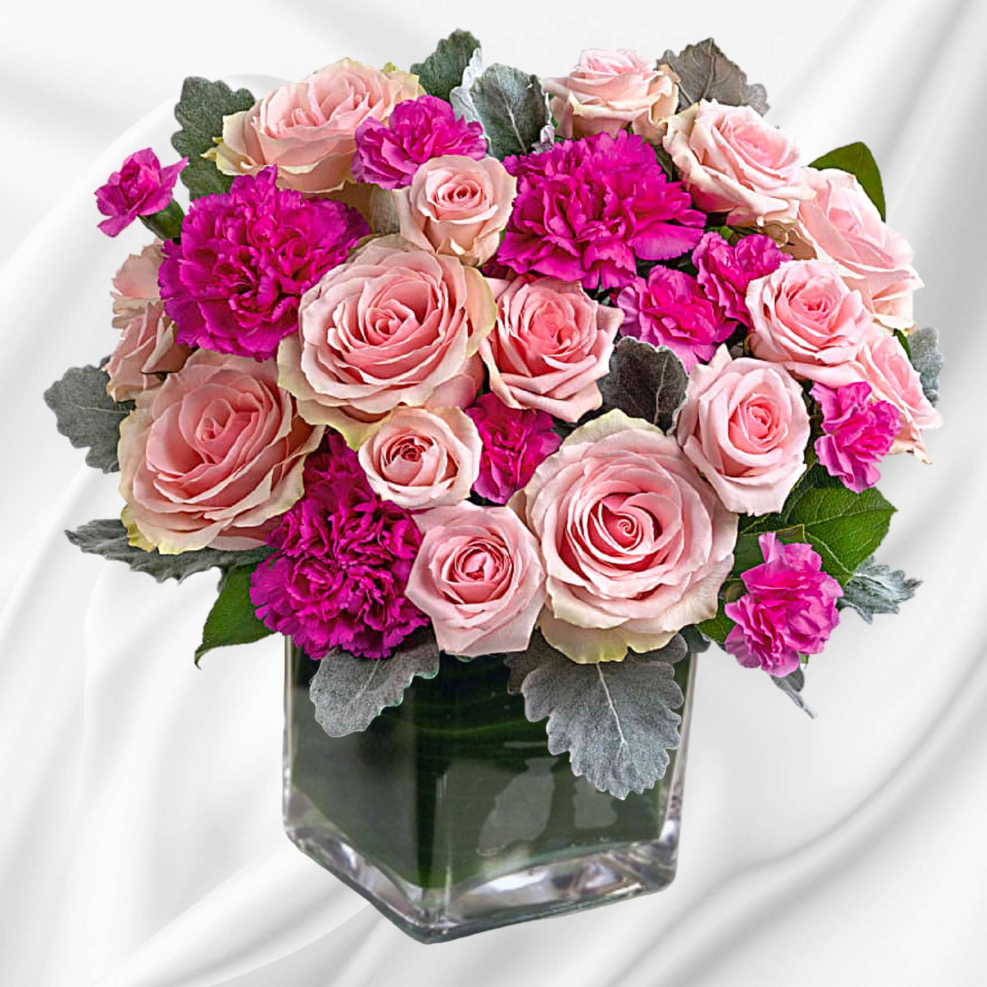 Pink roses and magenta carnations in a square glass vase, photo 2 of 4