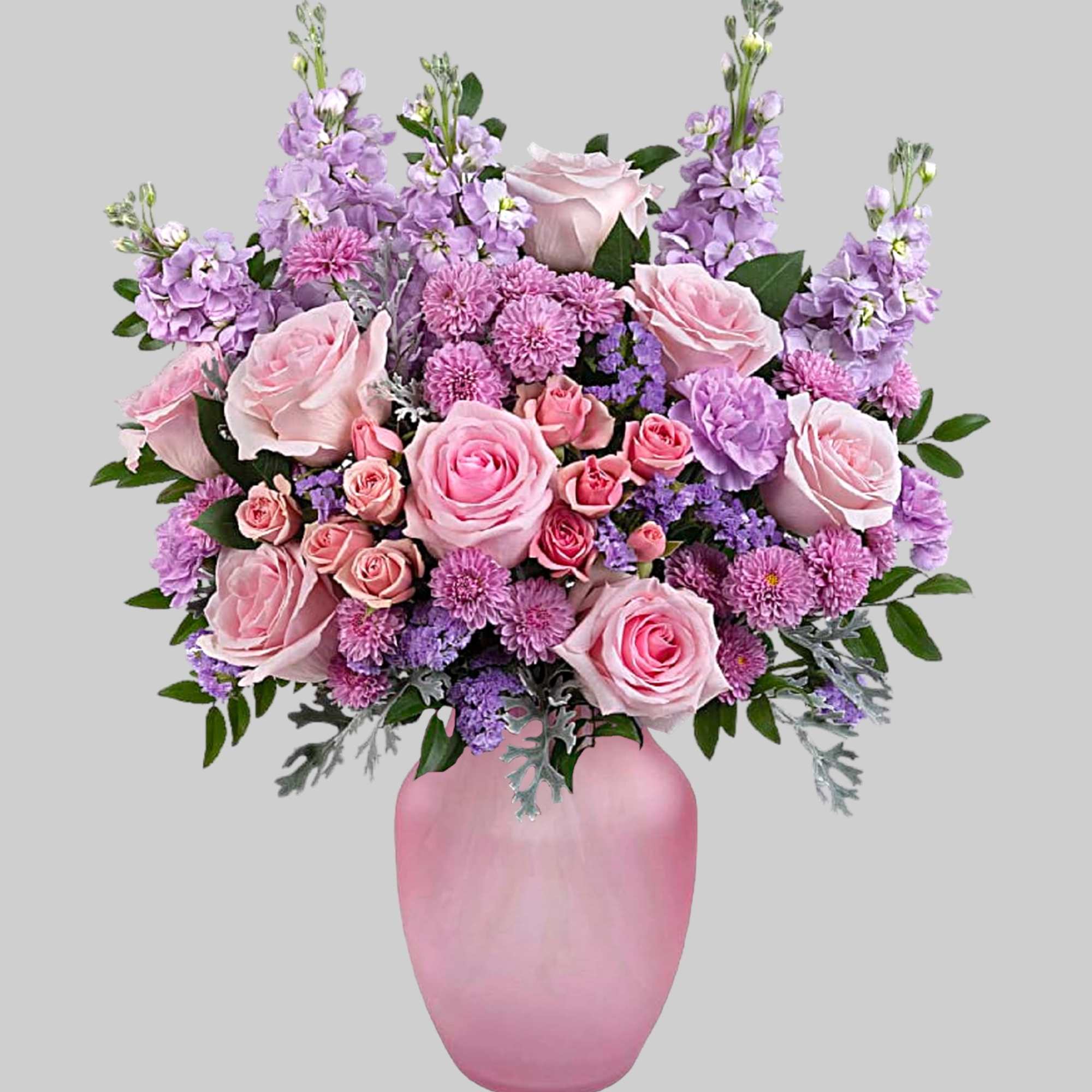 Pink and lavender flower arrangement in a pink vase, photo 2 of 4
