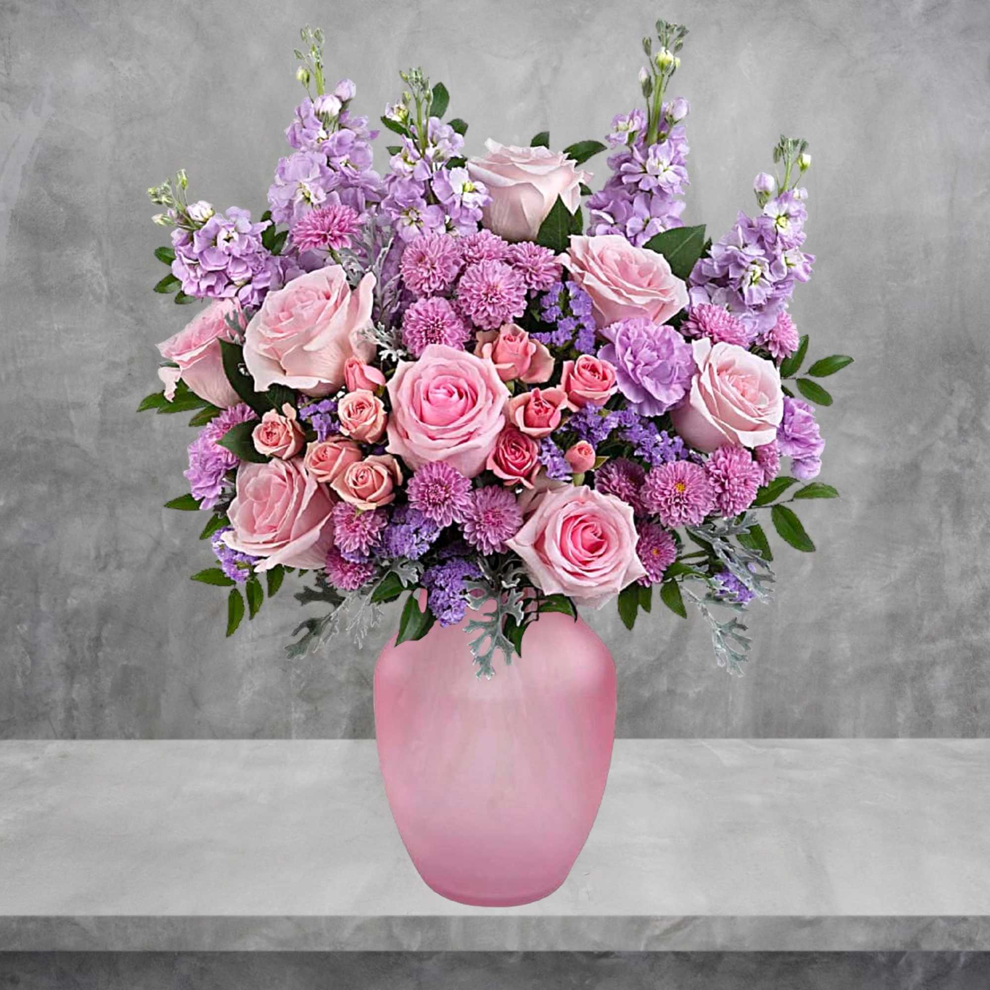 Pink and lavender flower arrangement in a pink vase, photo 3 of 4