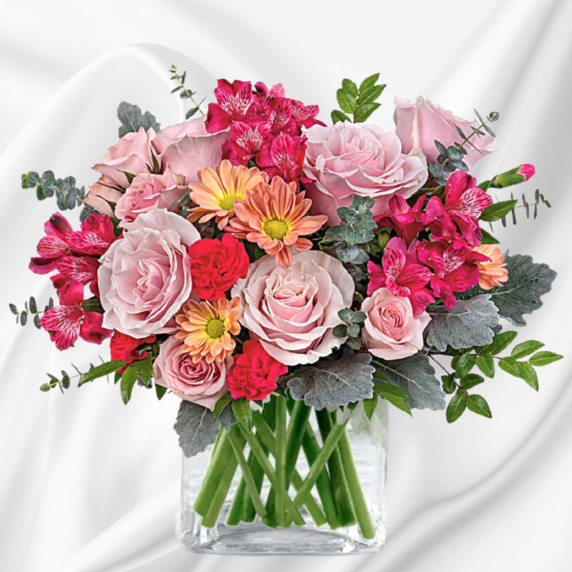 Pink and peach mixed bouquet in a clear glass vase, photo 2 of 4