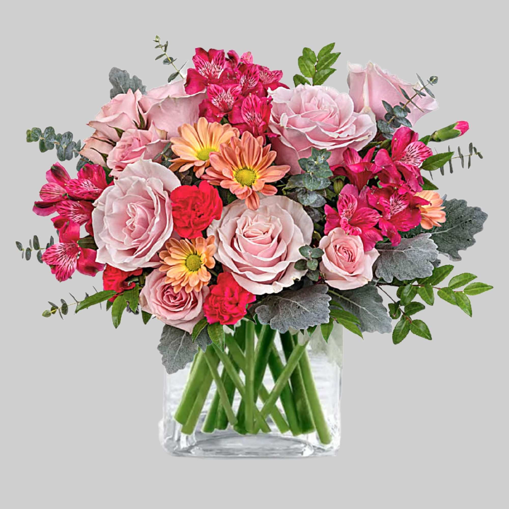 Pink roses and bright mixed flowers in a clear glass vase, photo 4 of 4