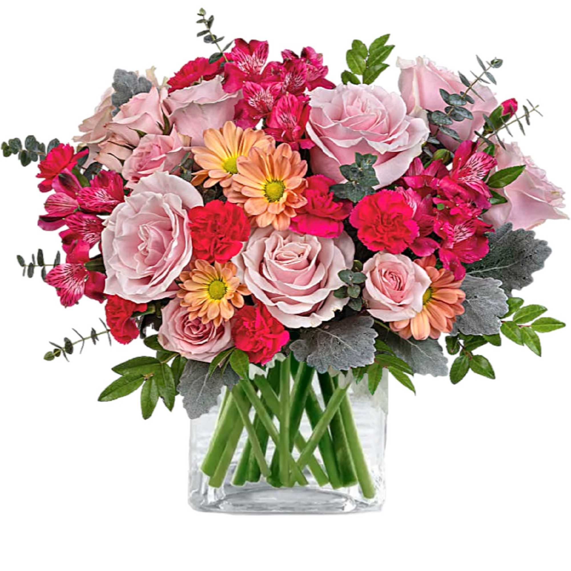 Pink roses and daisies arranged in a clear glass vase