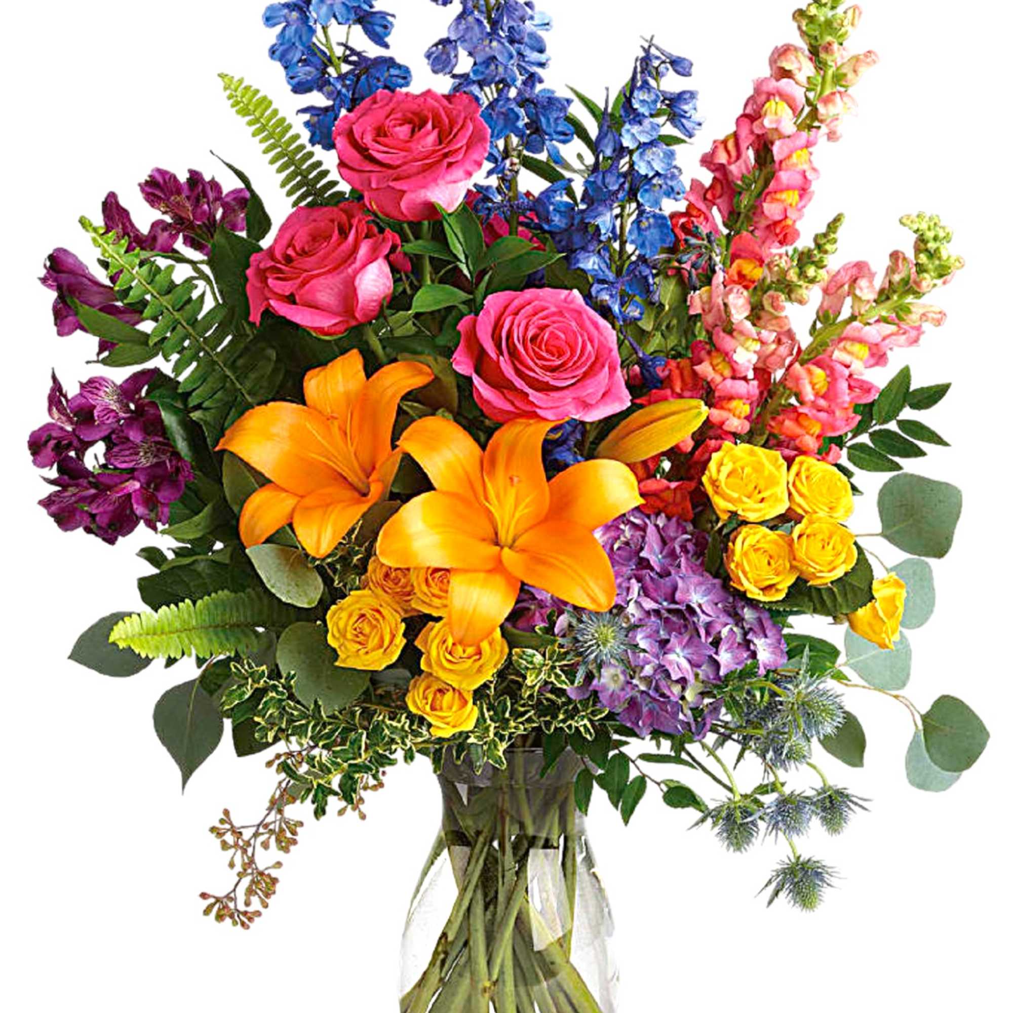 Colorful bouquet of roses, lilies, and mixed blooms in a glass vase