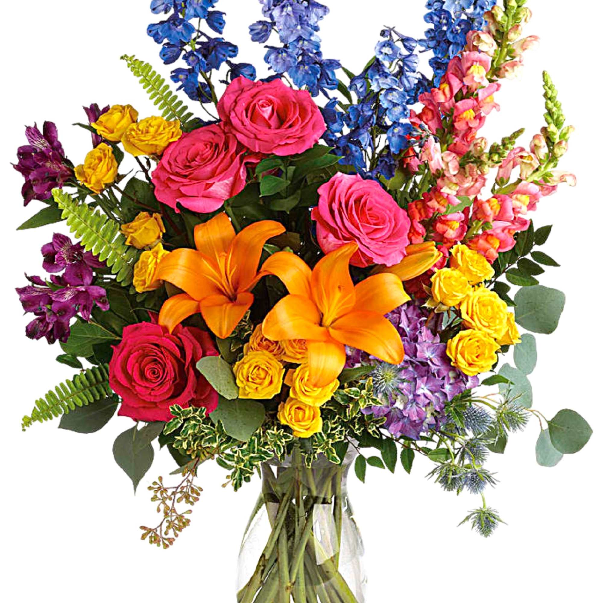 Colorful bouquet of roses, lilies, and delphinium in a glass vase