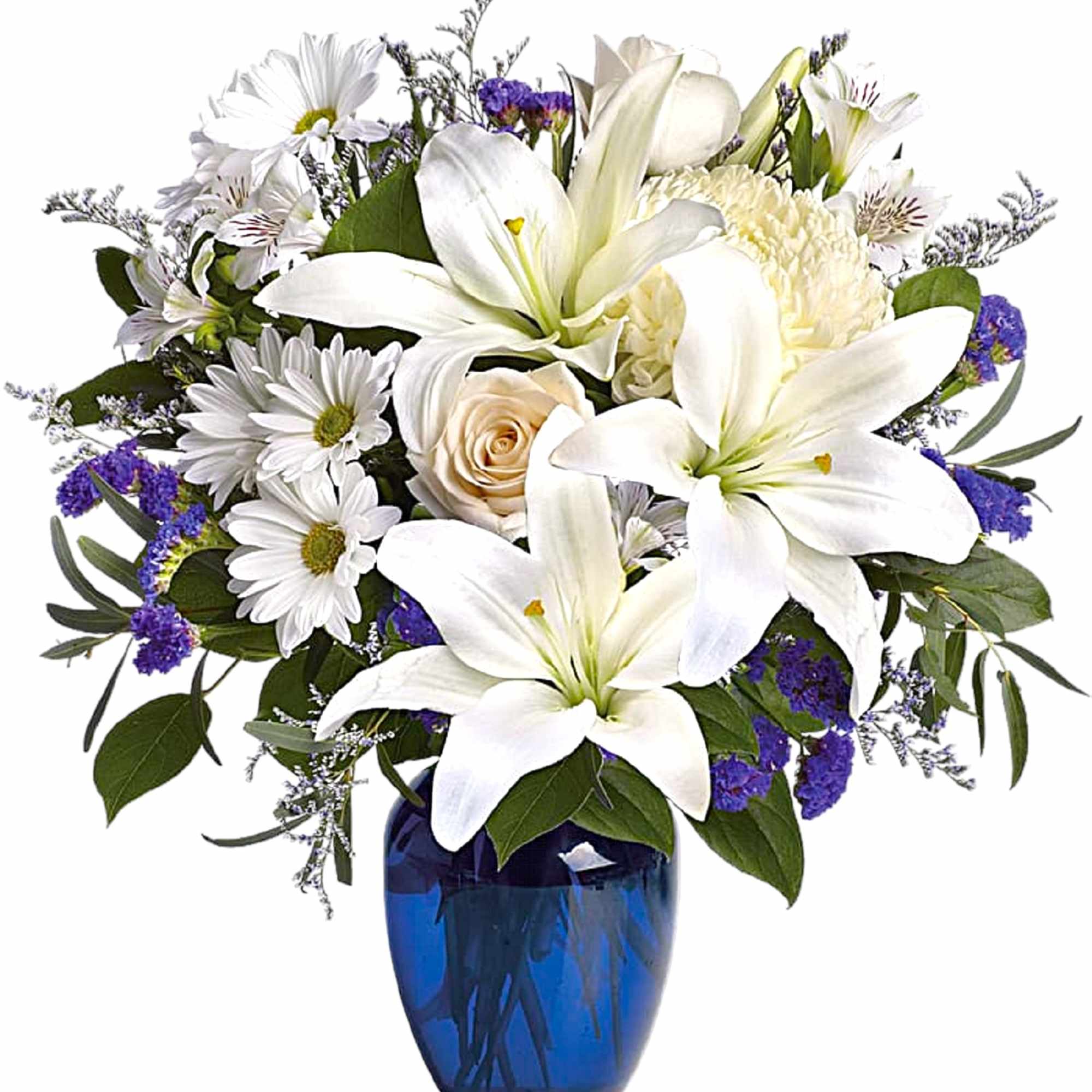 White lilies and daisies arranged in a blue vase
