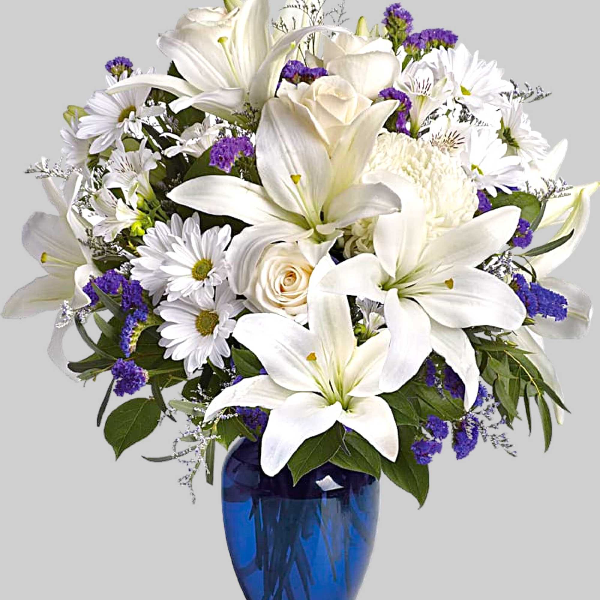 White lilies and daisies in a blue glass vase, photo 5 of 5