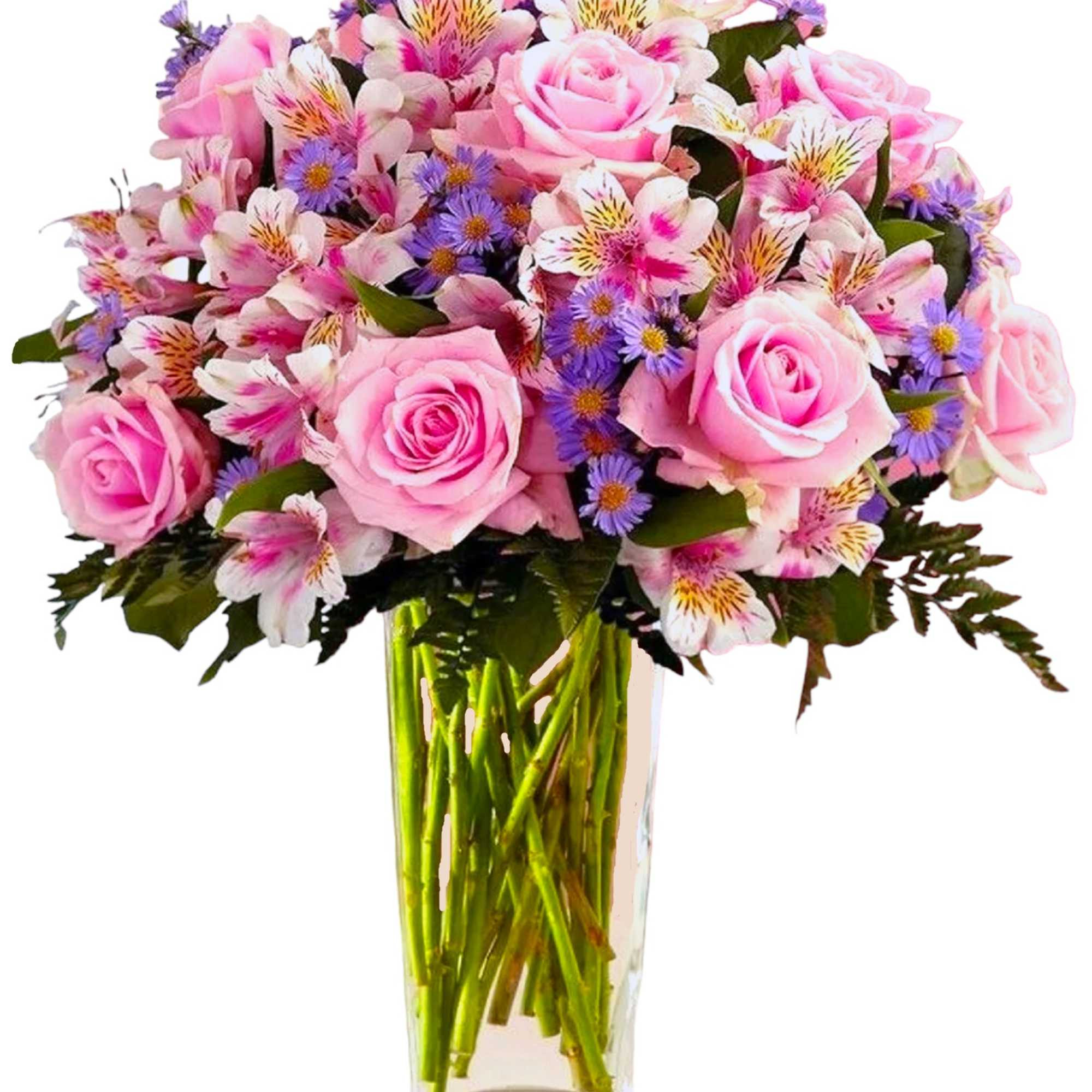 Pink roses and mixed purple flowers in a clear glass vase