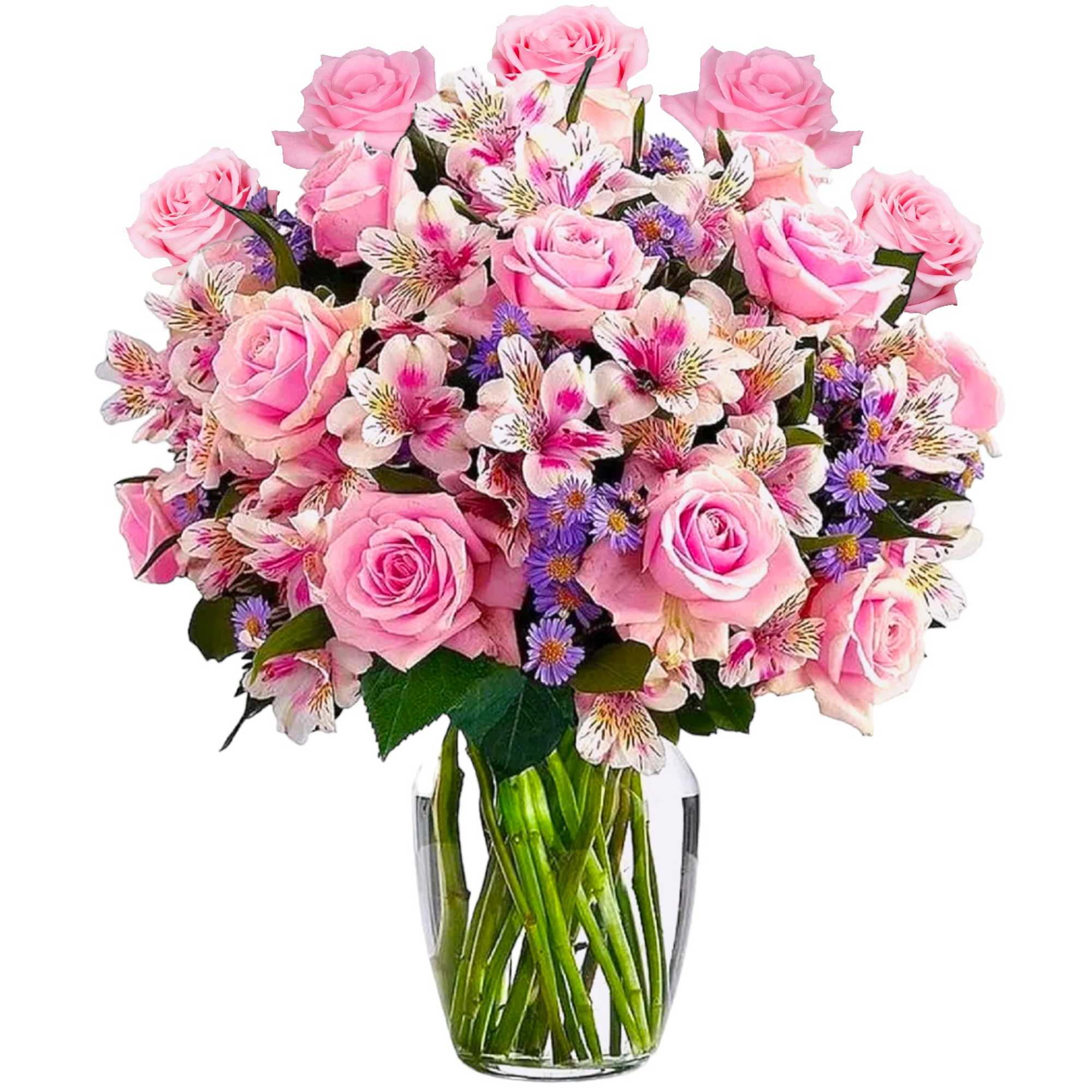 Pink roses and mixed blooms in a clear glass vase