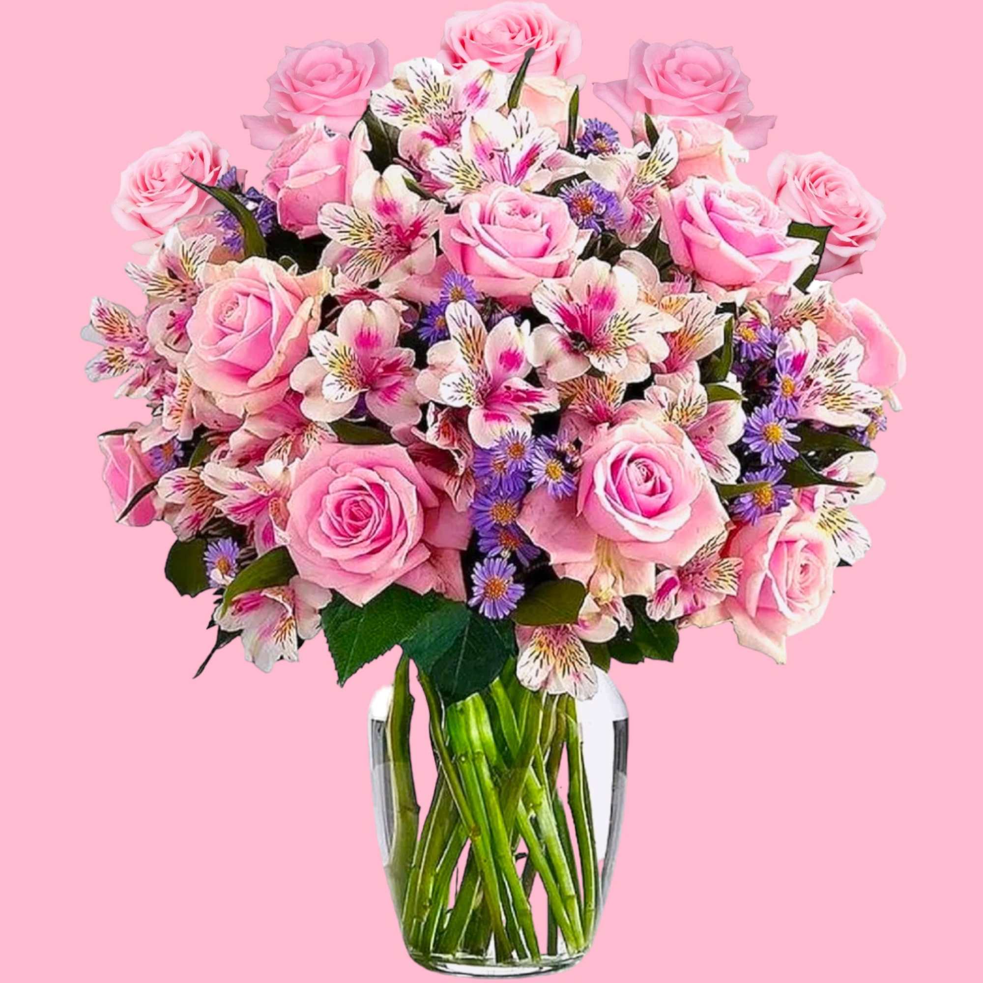 Pink roses and mixed blooms in a clear glass vase, photo 6 of 7
