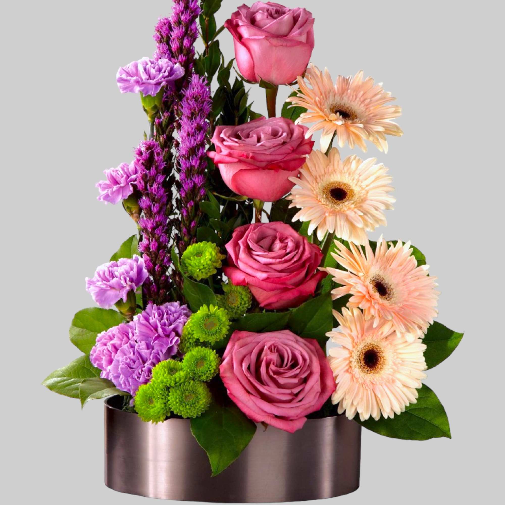 Pink roses and peach gerbera daisies in a metallic oval container, photo 5 of 5