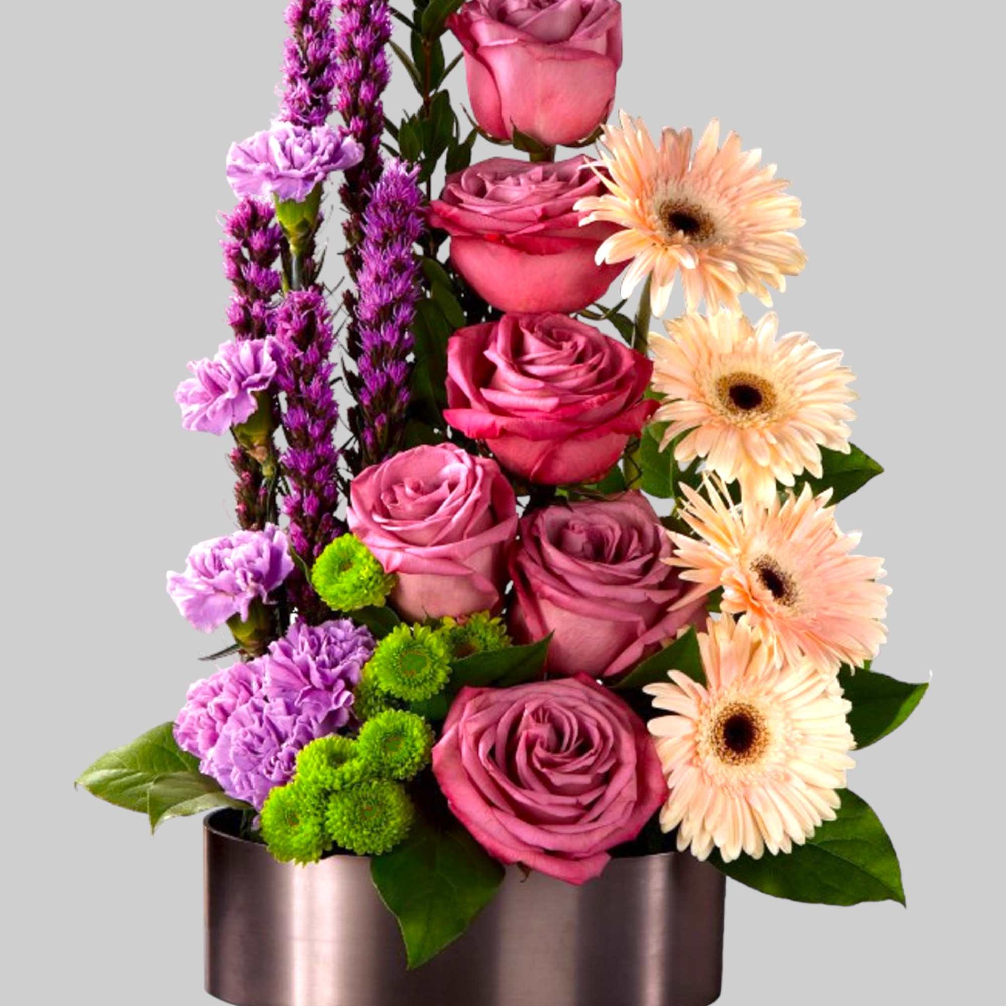 Pink roses with peach gerbera daisies in a metallic box