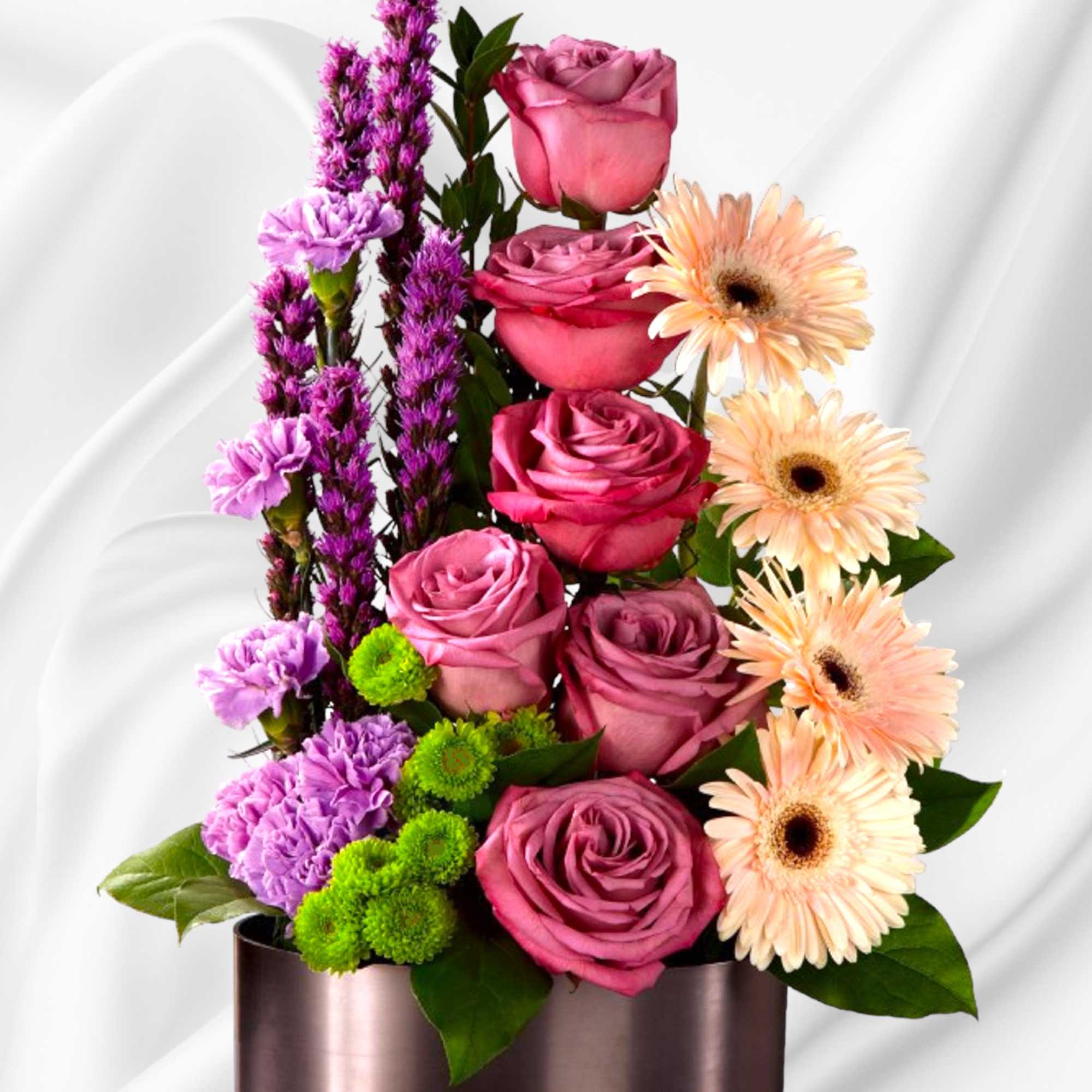 Pink roses and peach gerbera daisies in a metallic vase, photo 2 of 5