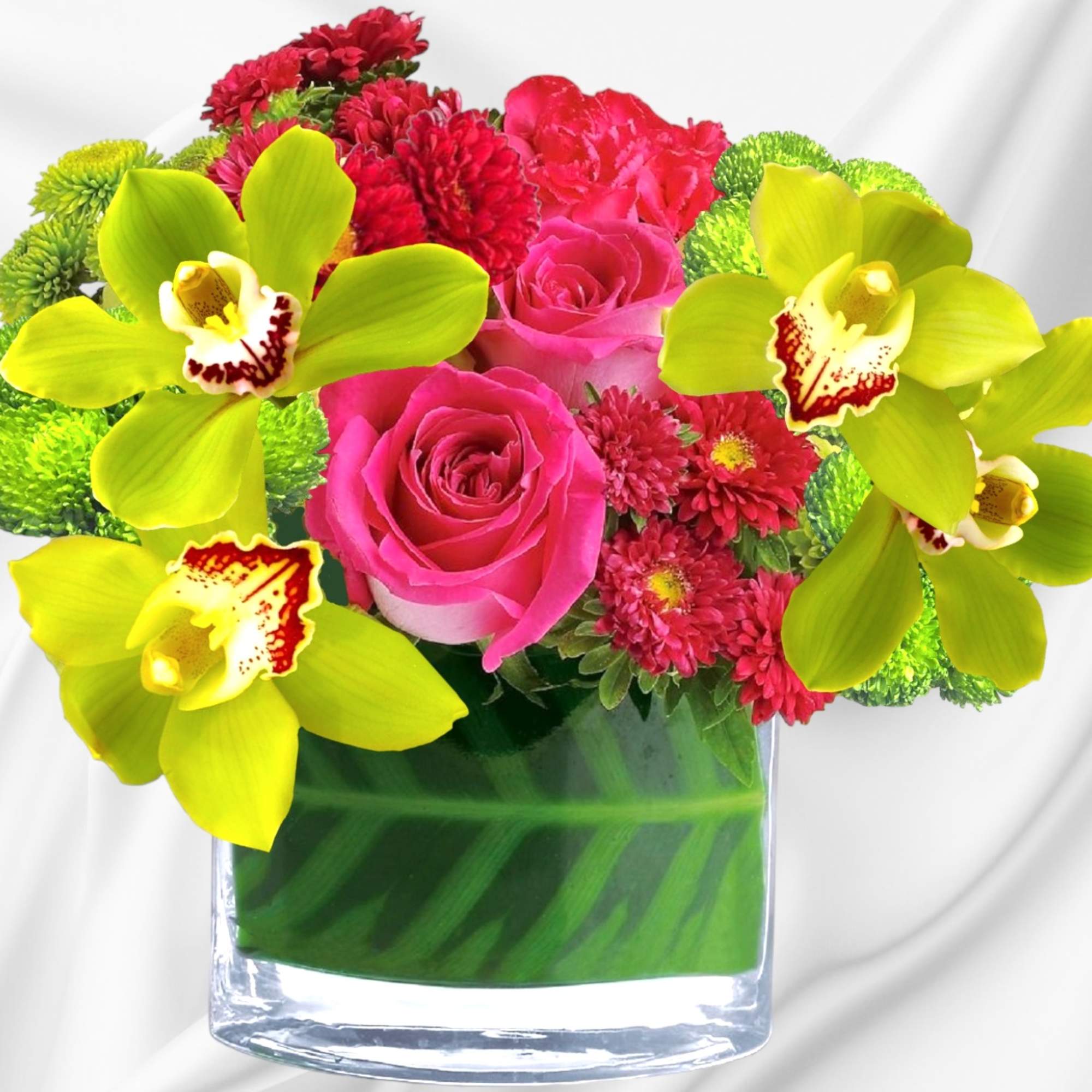 Pink roses and green orchids in a glass vase