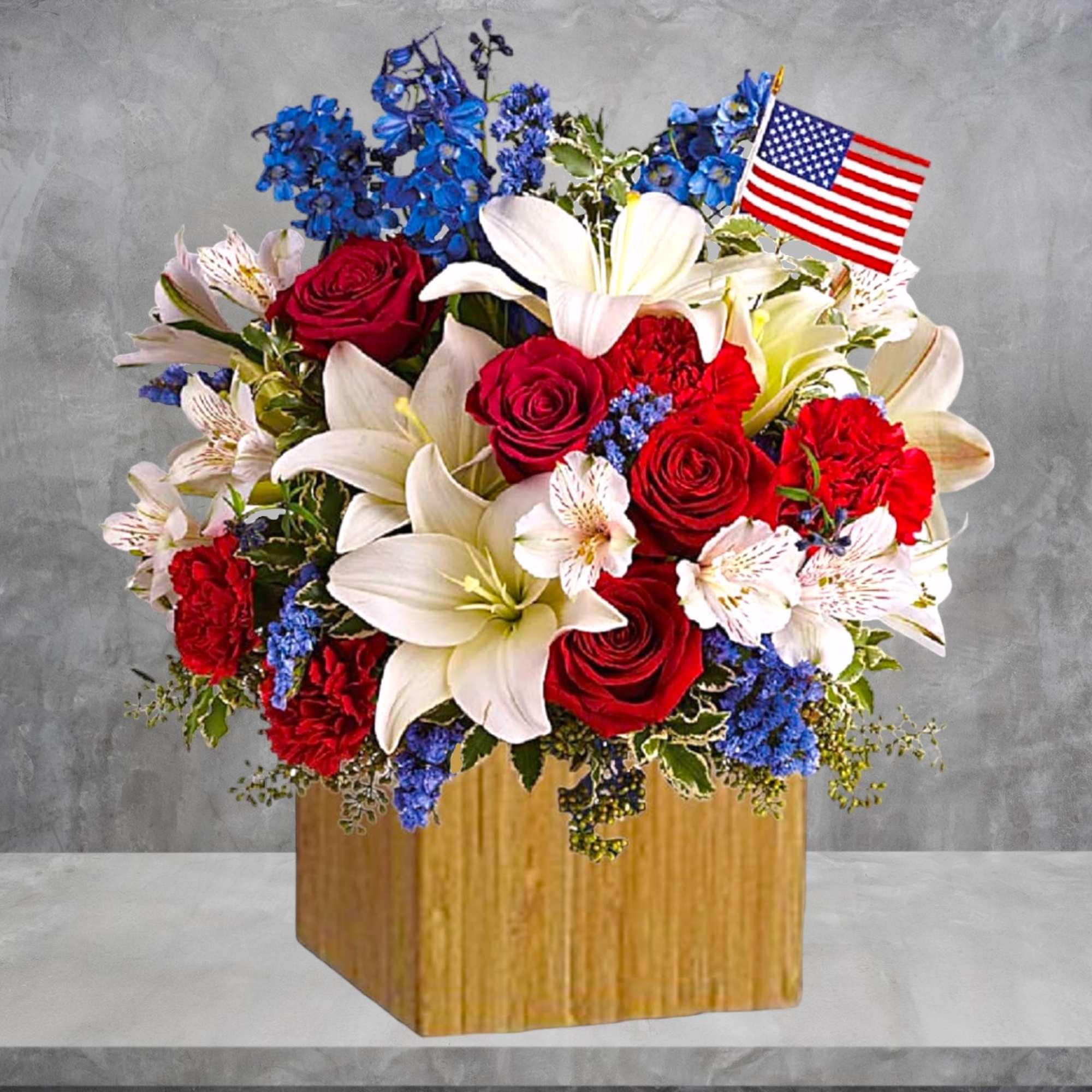 Red roses and white lilies in a wooden box with a small American flag., photo 3 of 4