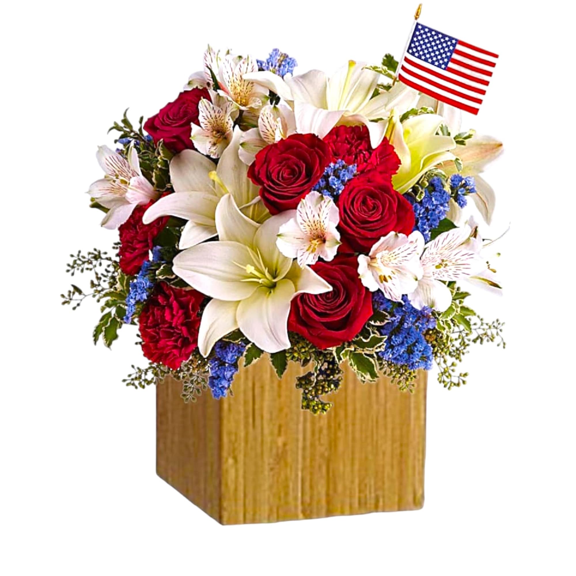 Red roses and white lilies in a wooden vase with a small American flag
