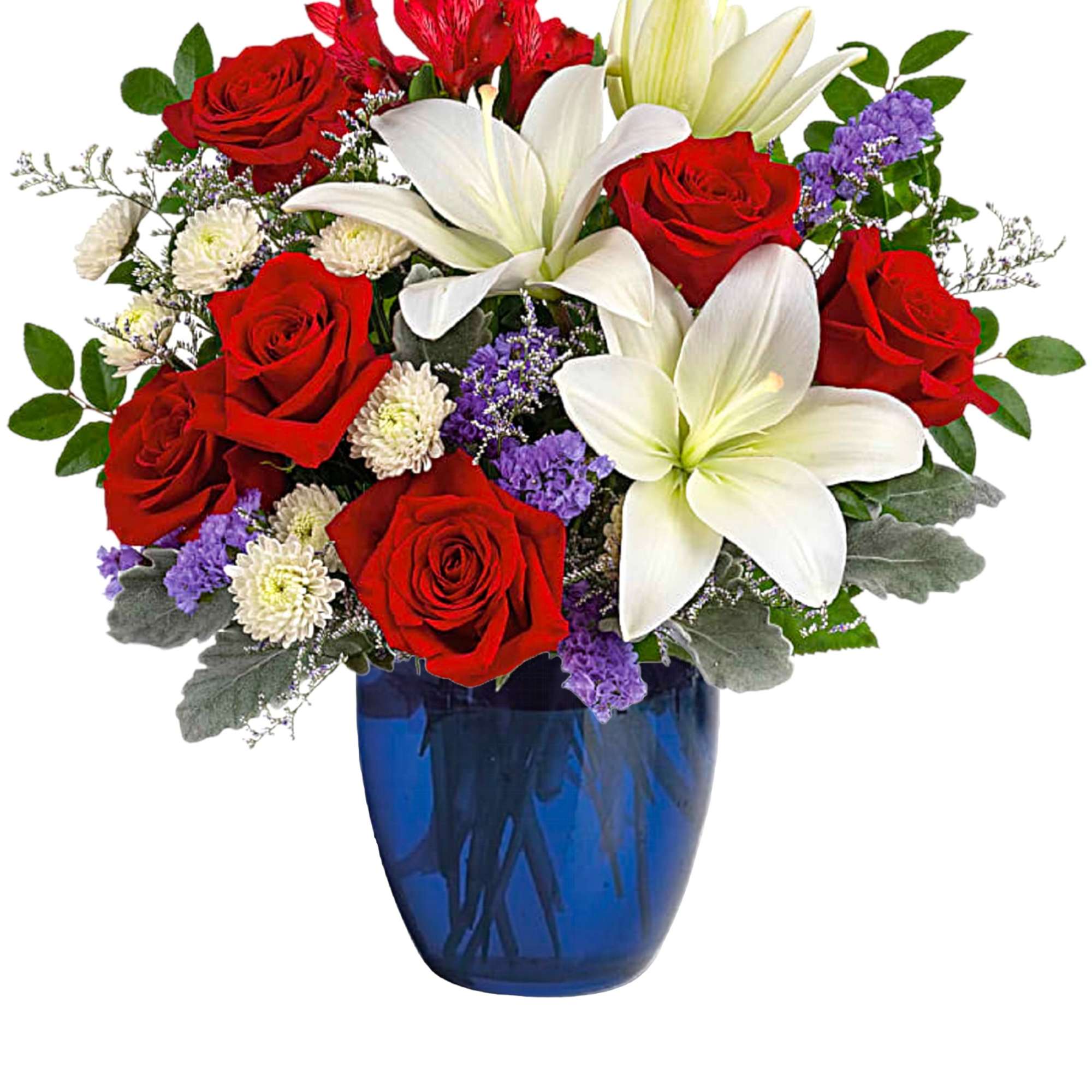 Red roses and white lilies arranged in a blue glass vase