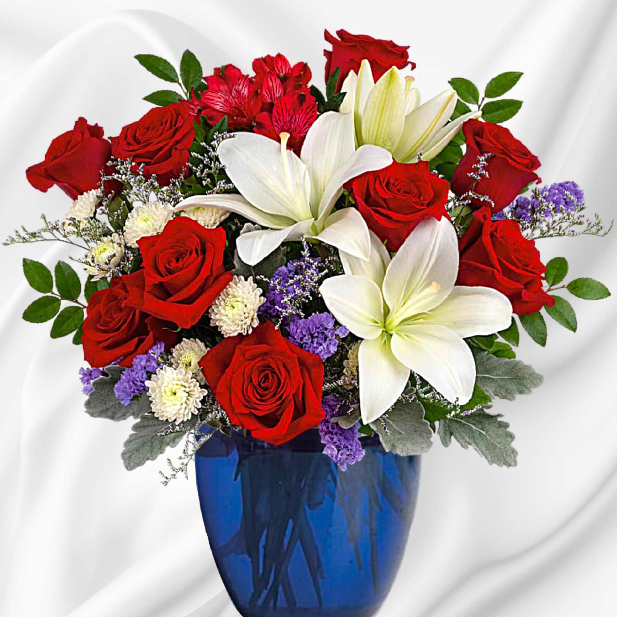 Red roses and white lilies in a blue vase
