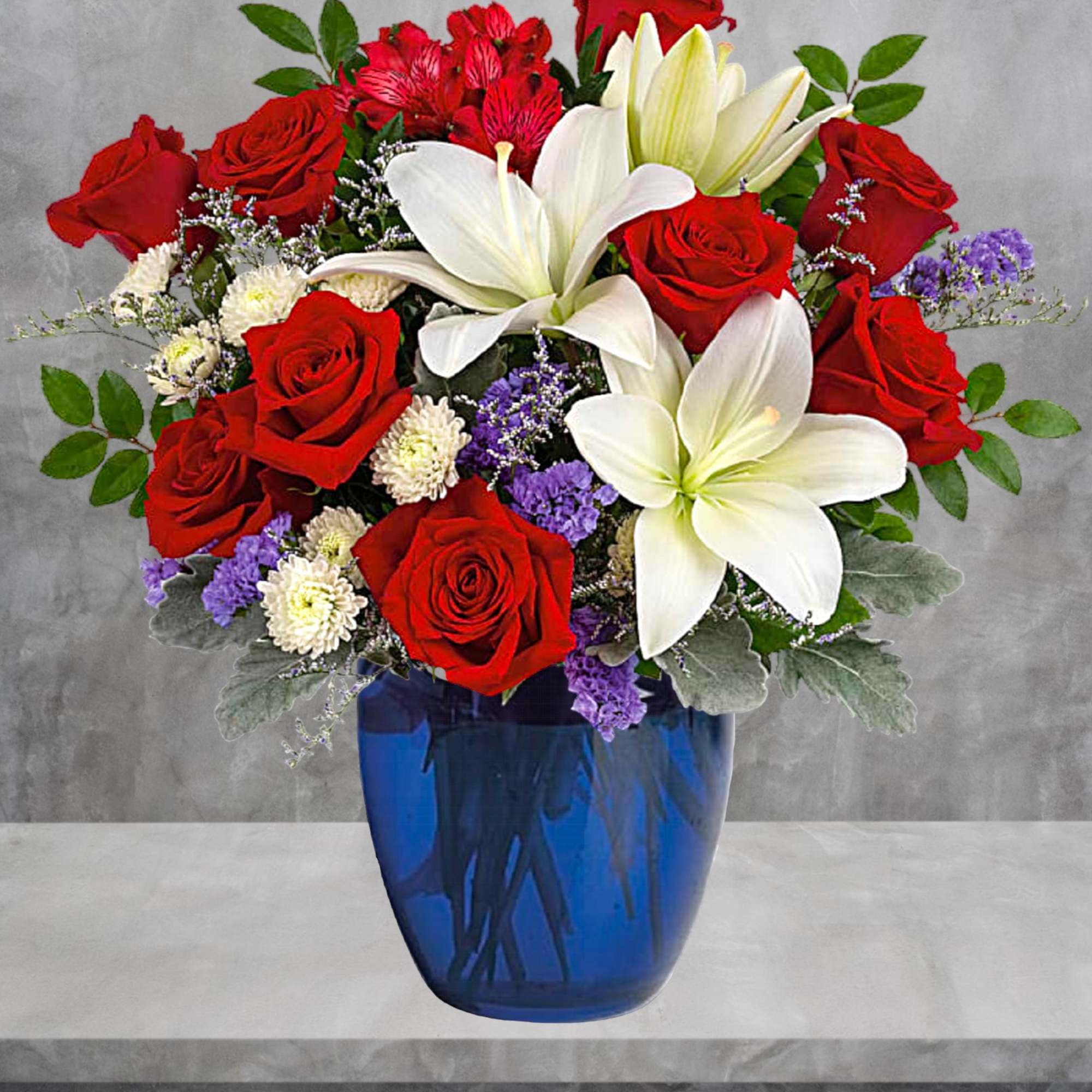 Red roses and white lilies arranged in a blue vase, photo 4 of 4