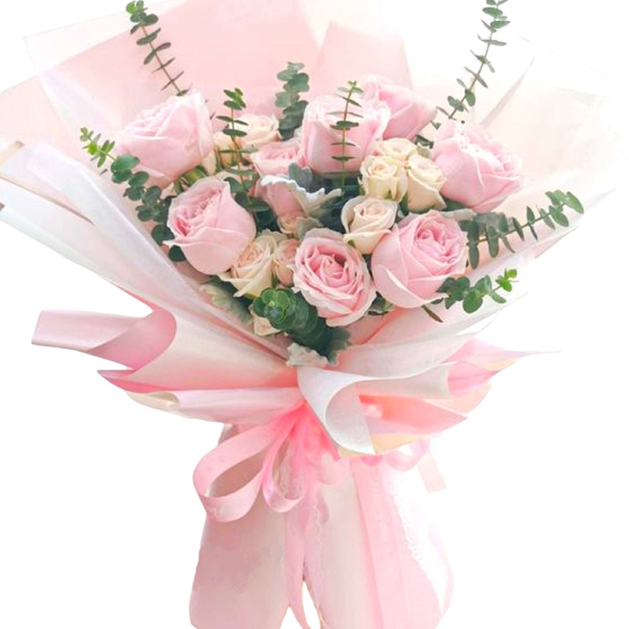 Pink and cream rose bouquet wrapped in pale pink paper
