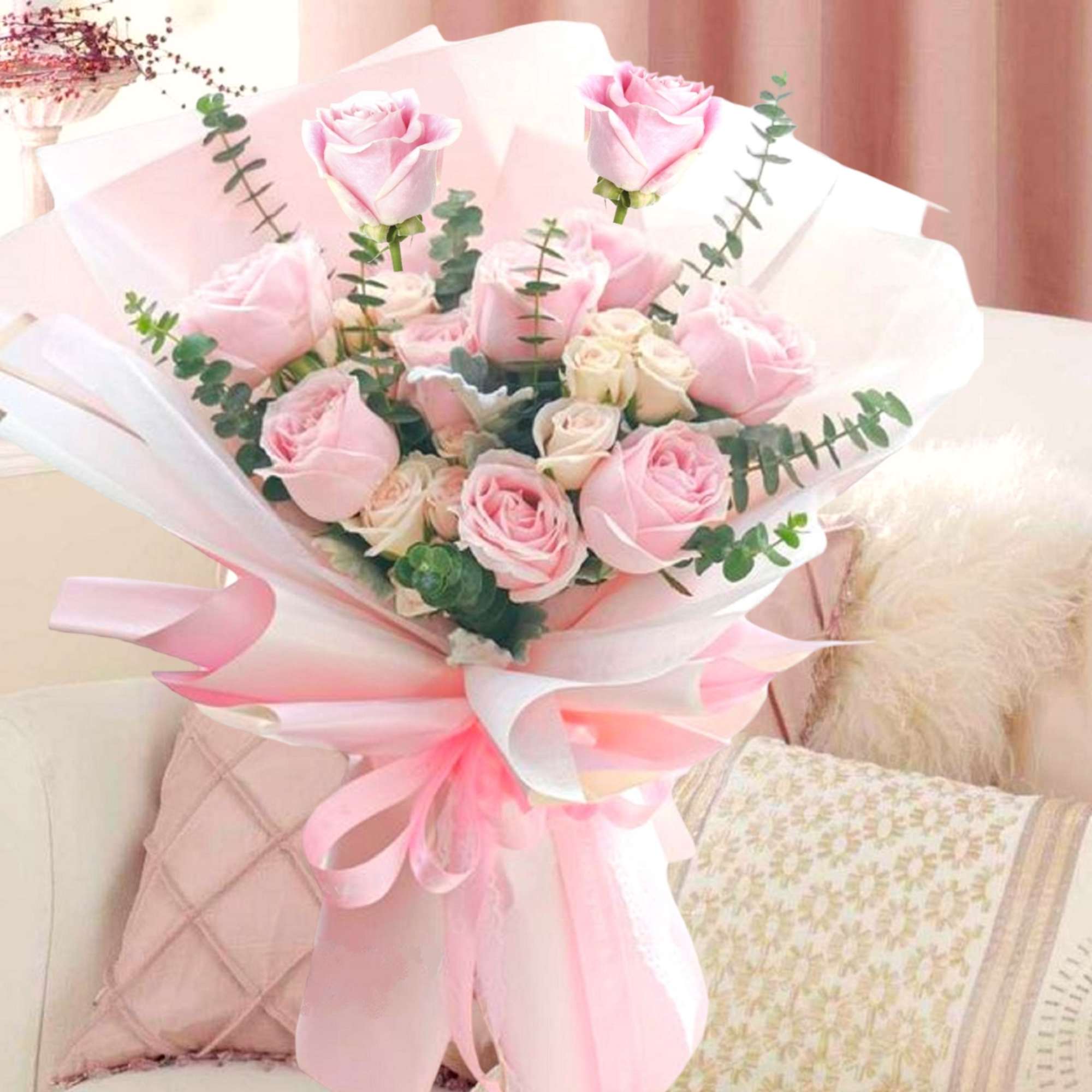 Bouquet of pink roses wrapped in white and pink paper