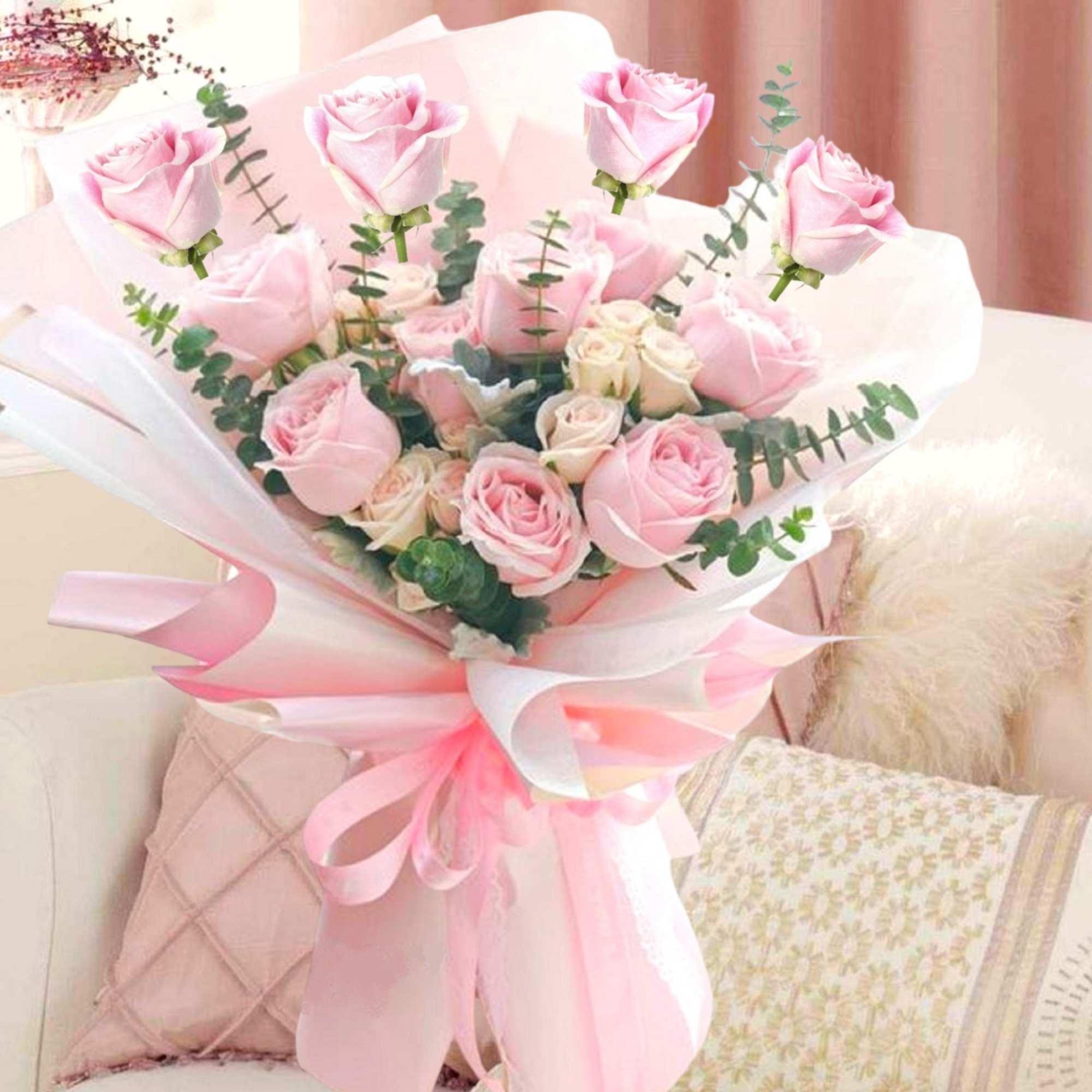 Bouquet of pink roses wrapped in white and pink paper