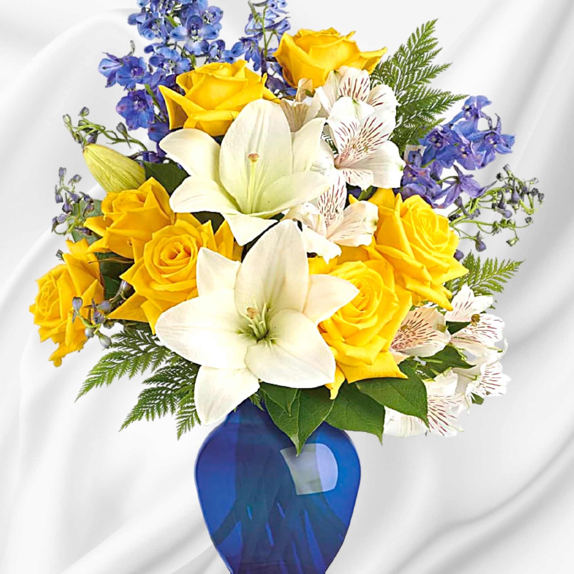 Yellow roses and white lilies in a blue vase, photo 2 of 4