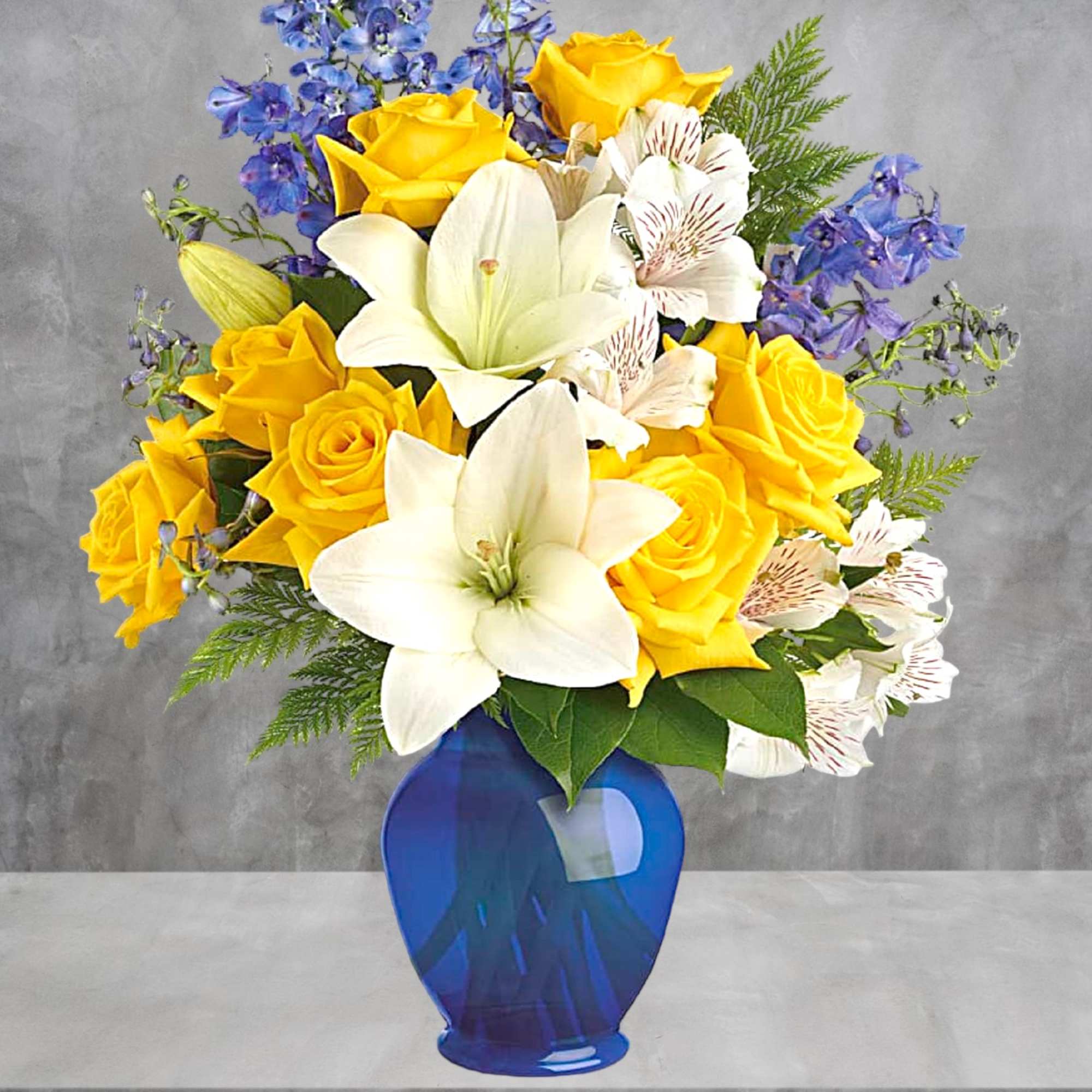 Yellow roses and white lilies in a blue vase, photo 3 of 4