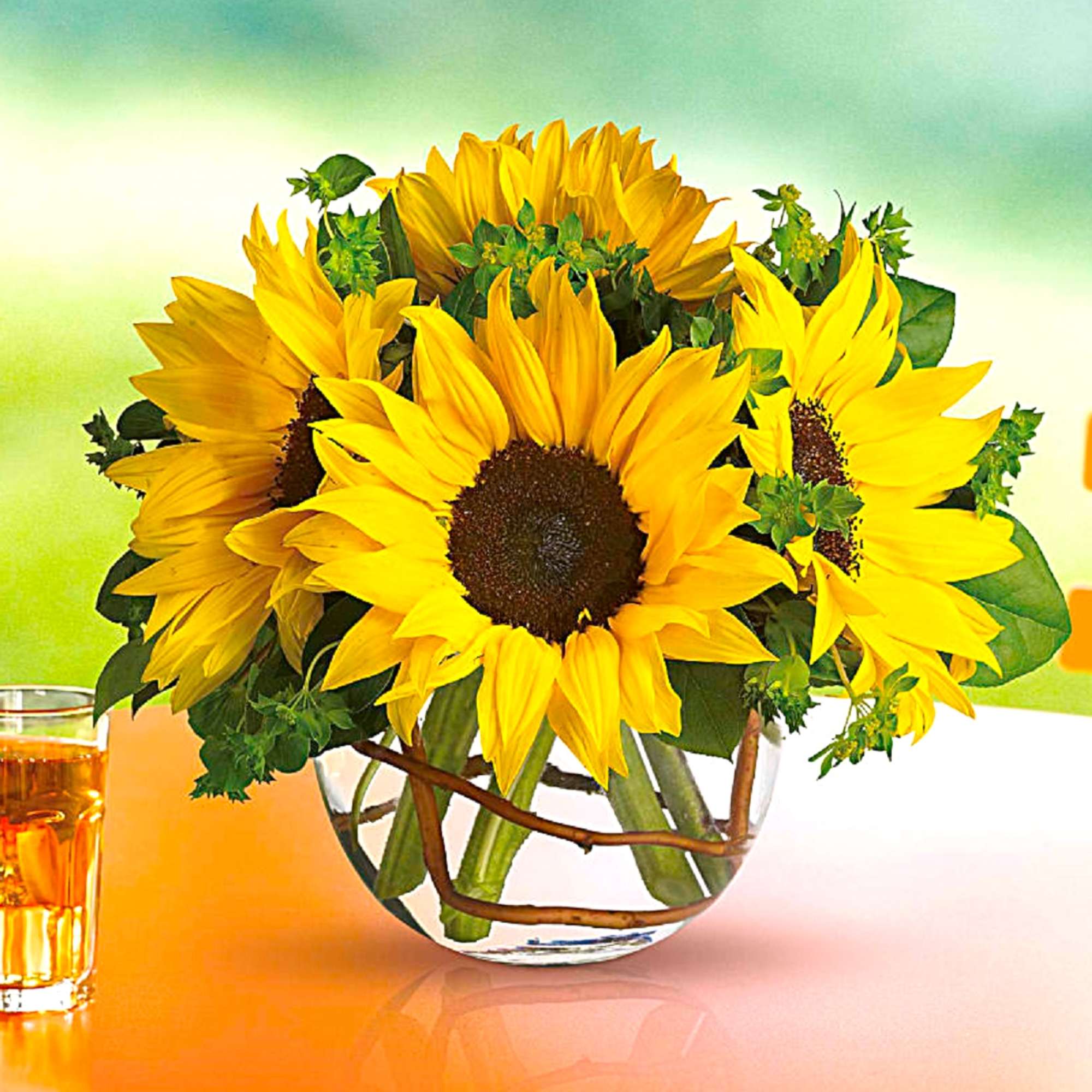 Sunflower arrangement in a clear glass vase