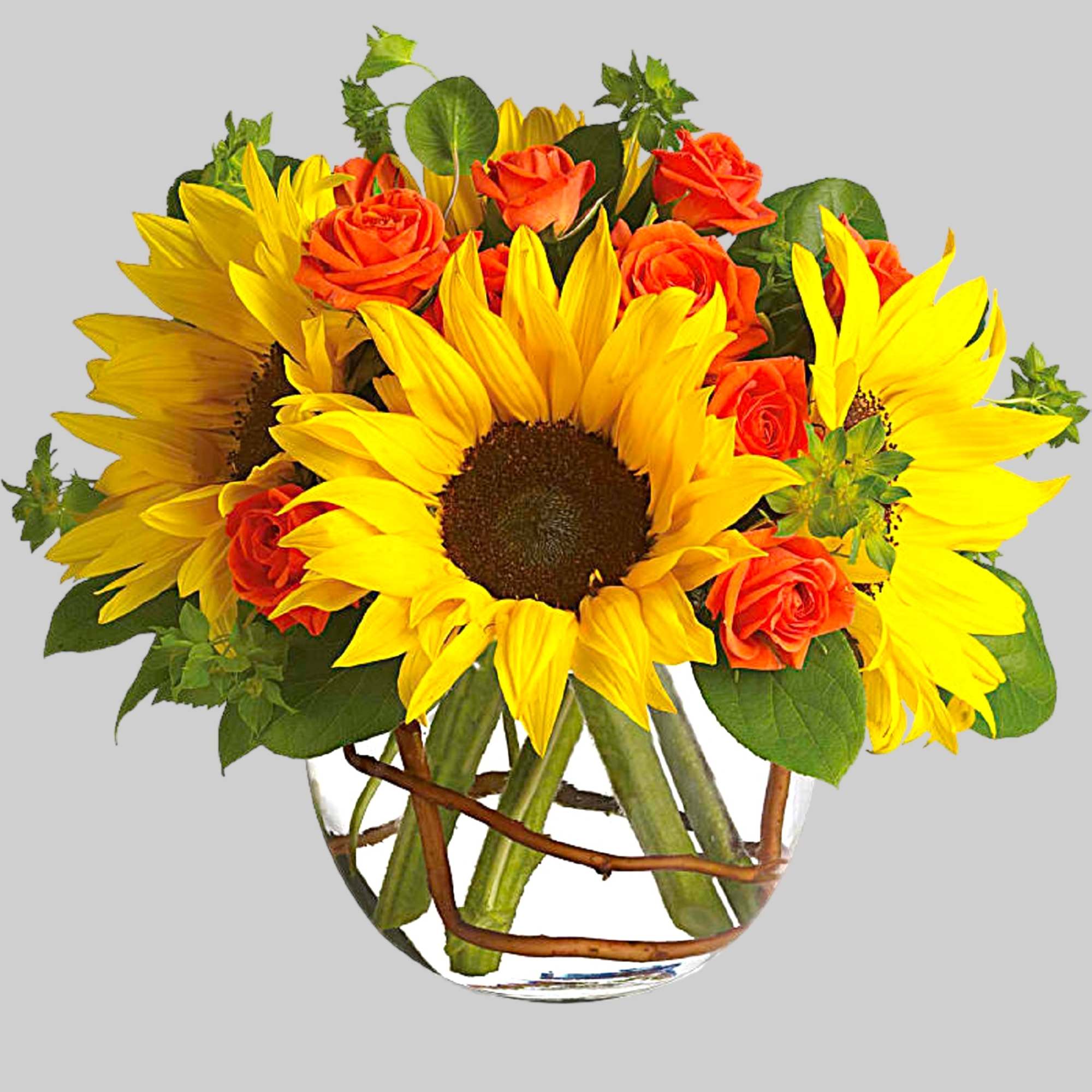 Sunflowers and orange roses arranged in a clear glass vase, photo 6 of 6