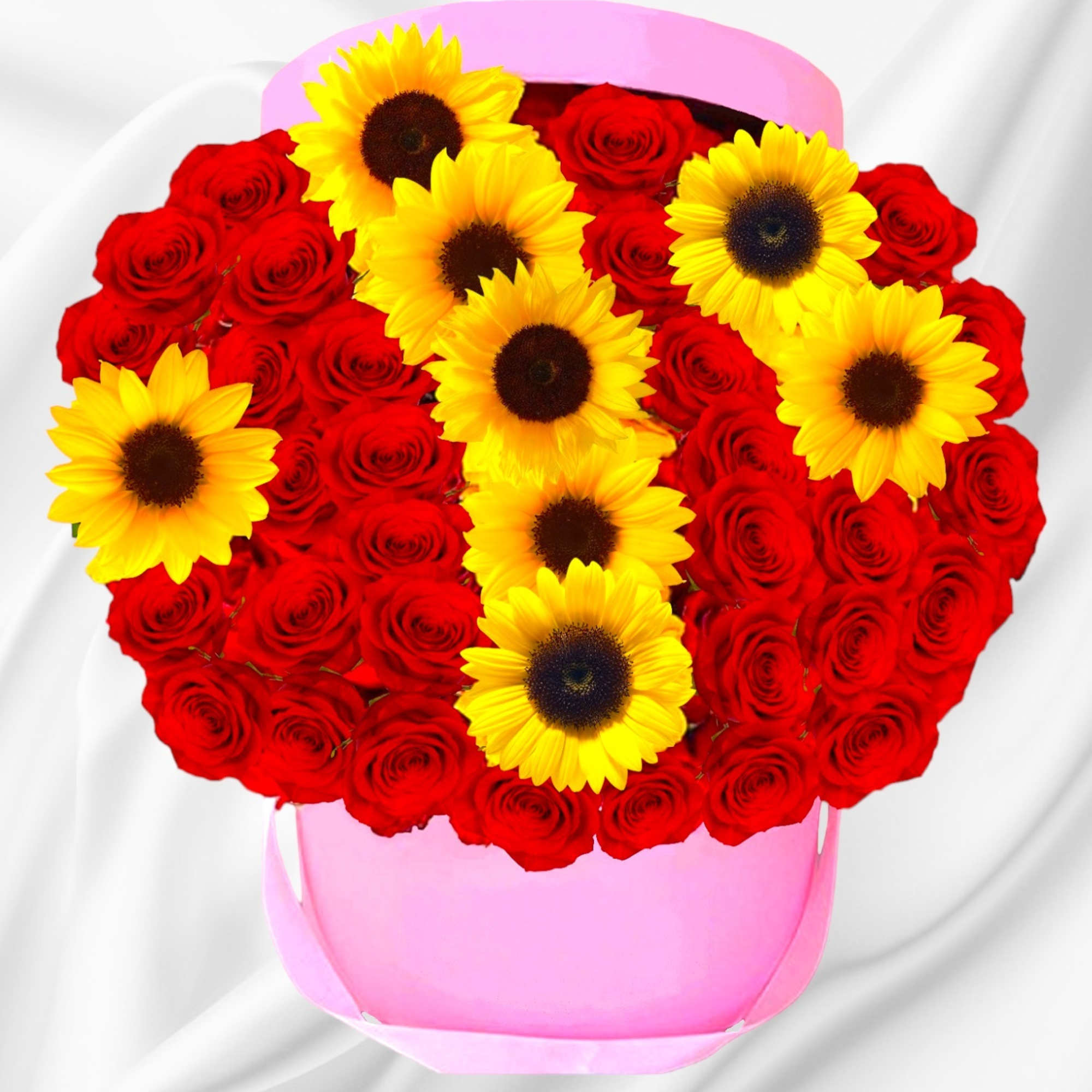 Heart-shaped bouquet of red roses and yellow sunflowers in a pink box