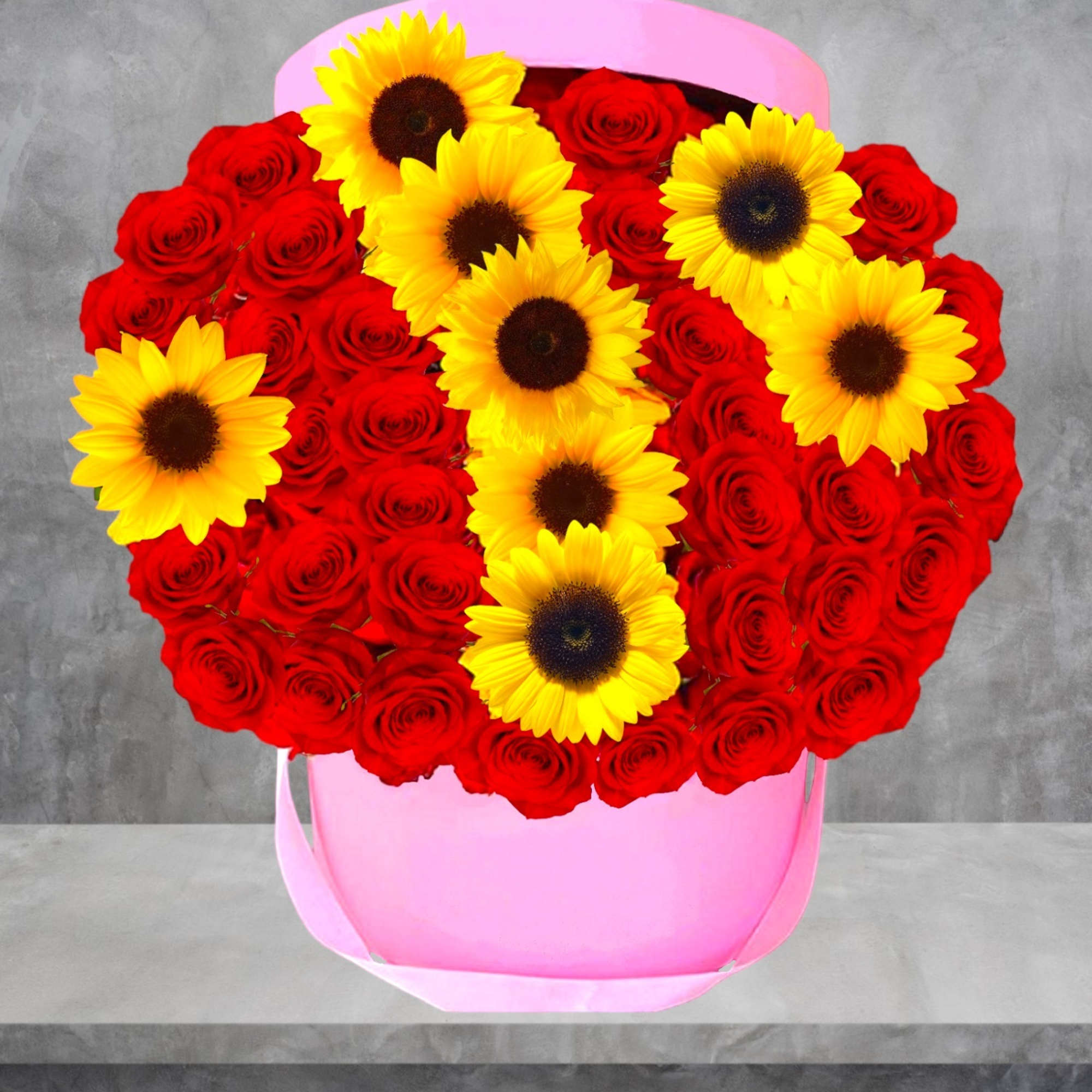 Heart-shaped box of red roses with yellow sunflowers