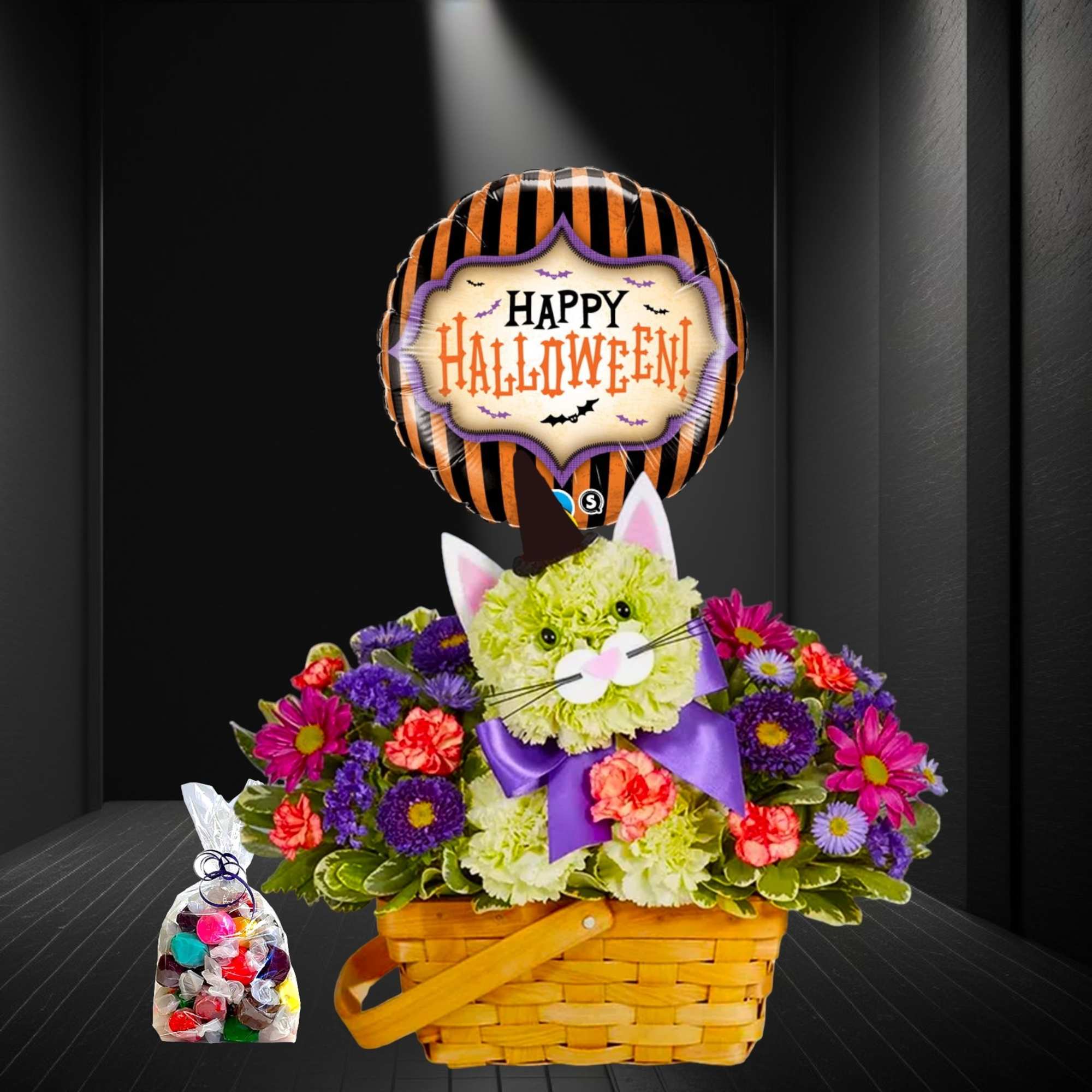Halloween flower basket with a cat face and balloon, plus a bag of candy