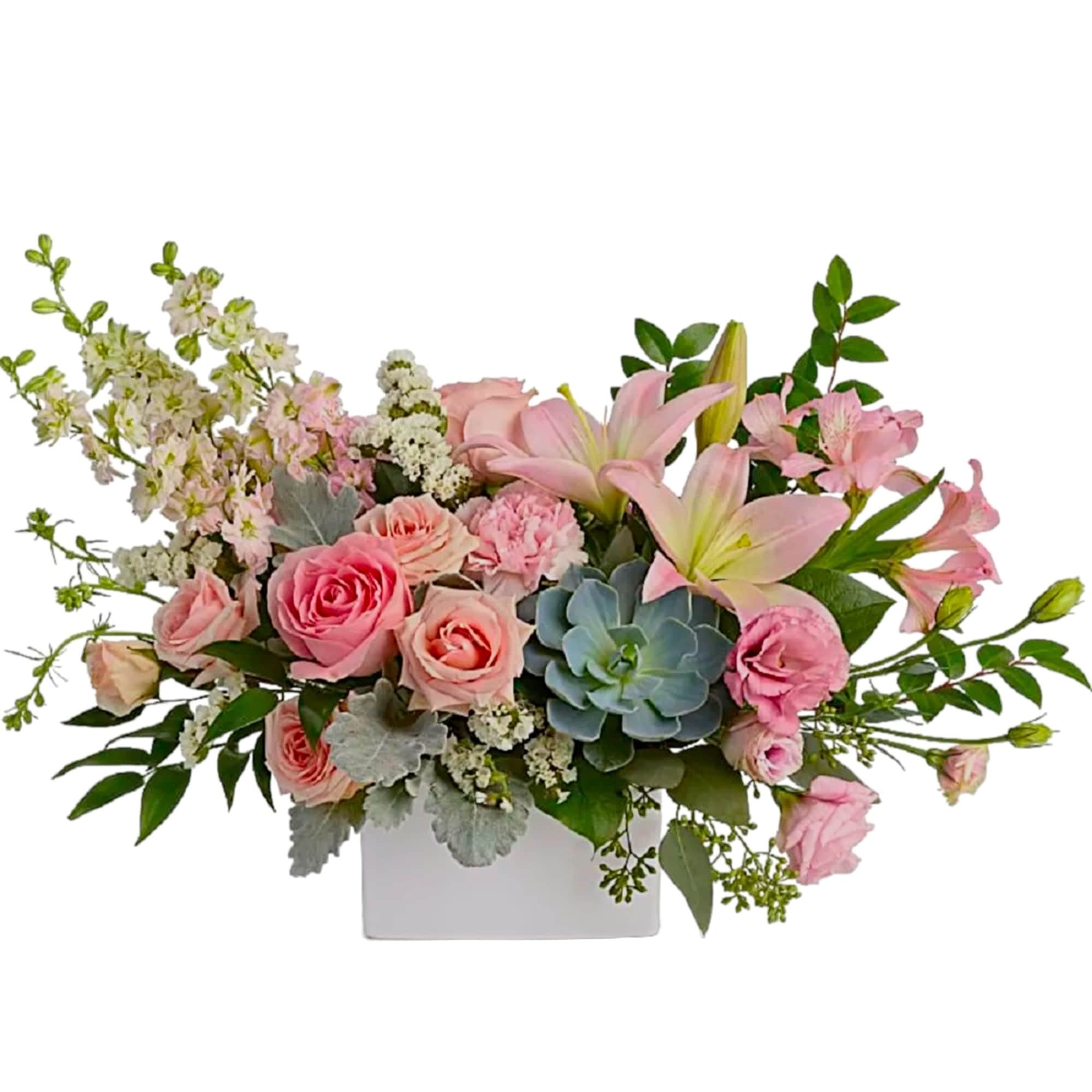 Pink roses and lilies in a white rectangular vase