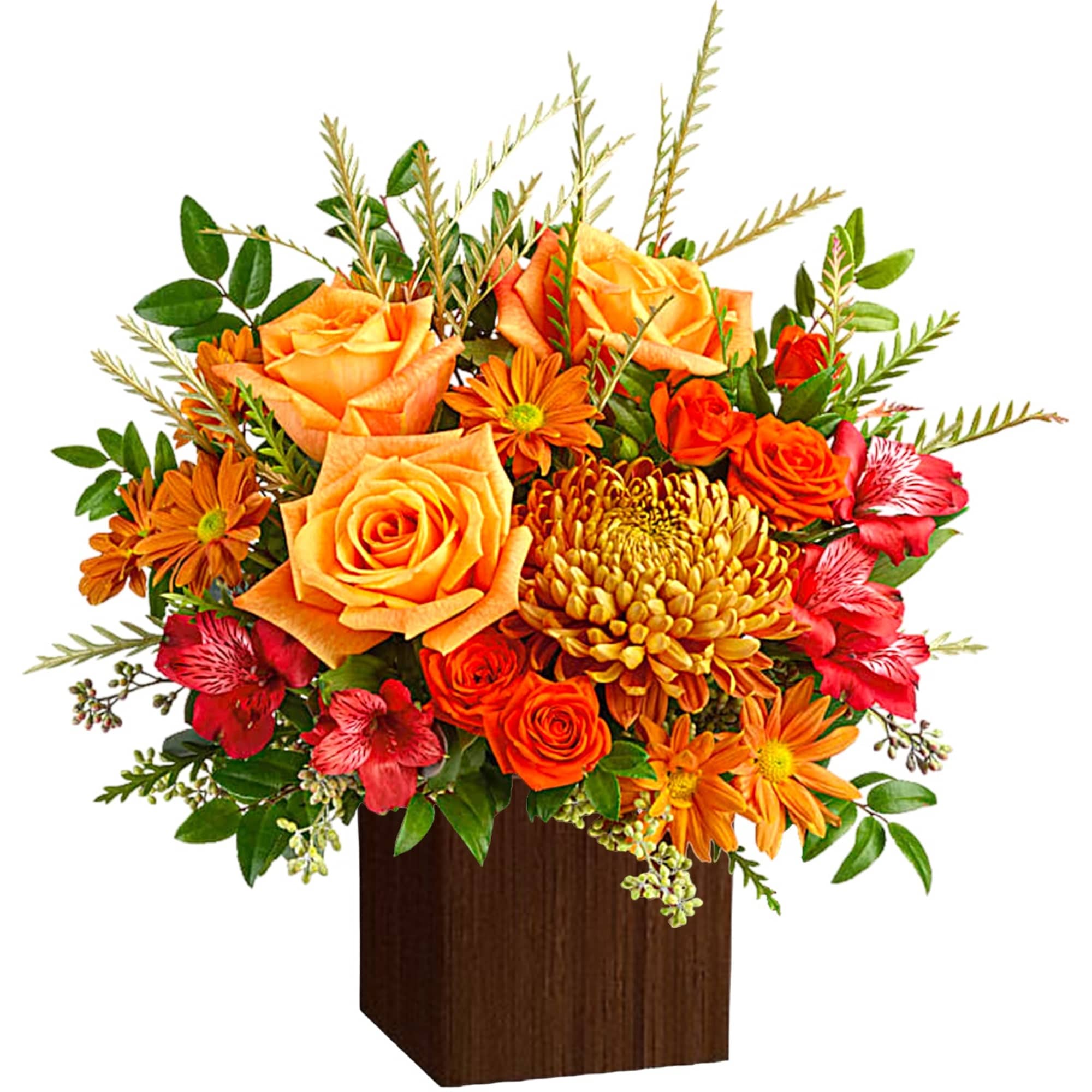 Orange and red mixed flower arrangement in a dark wooden vase