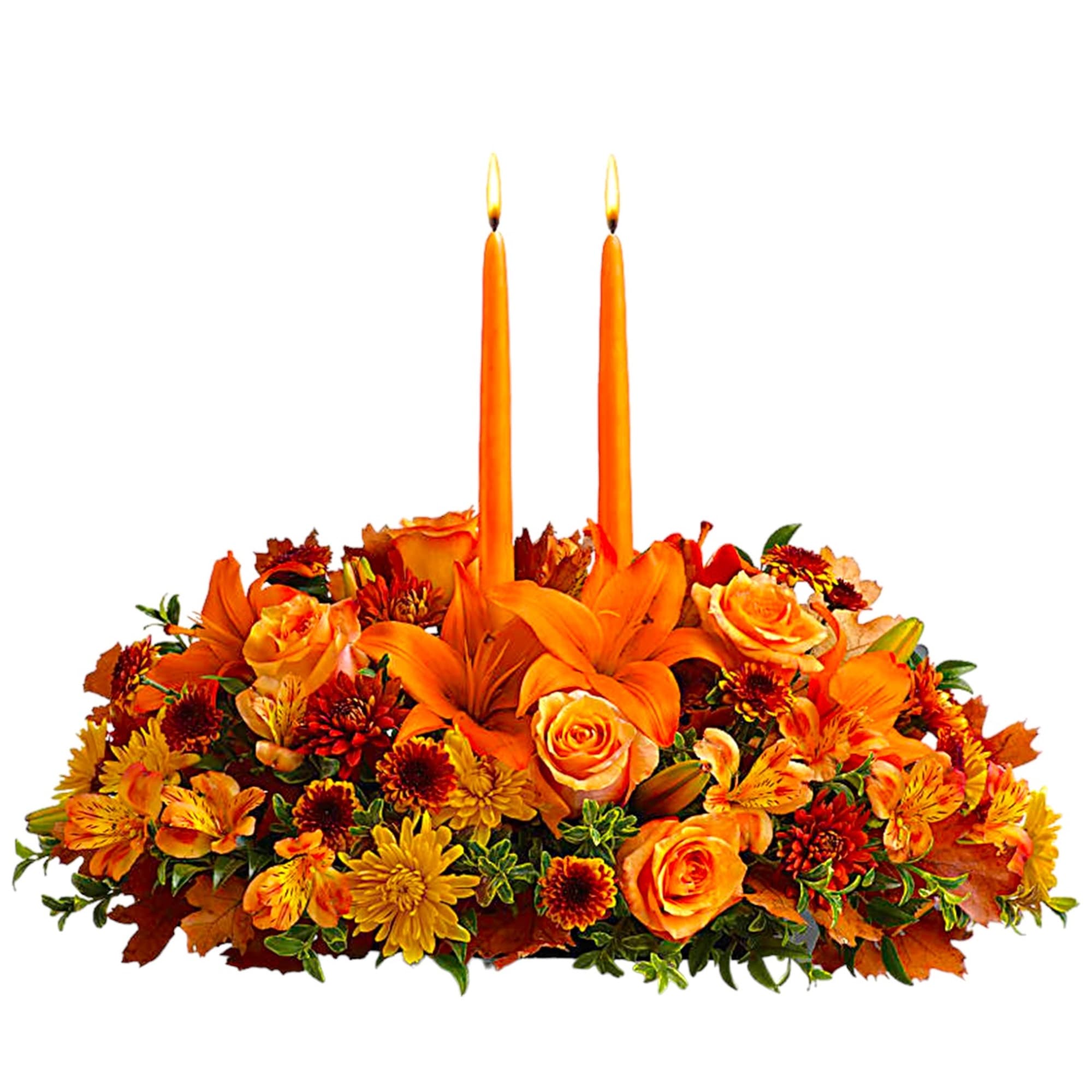 Orange floral centerpiece with two lit taper candles