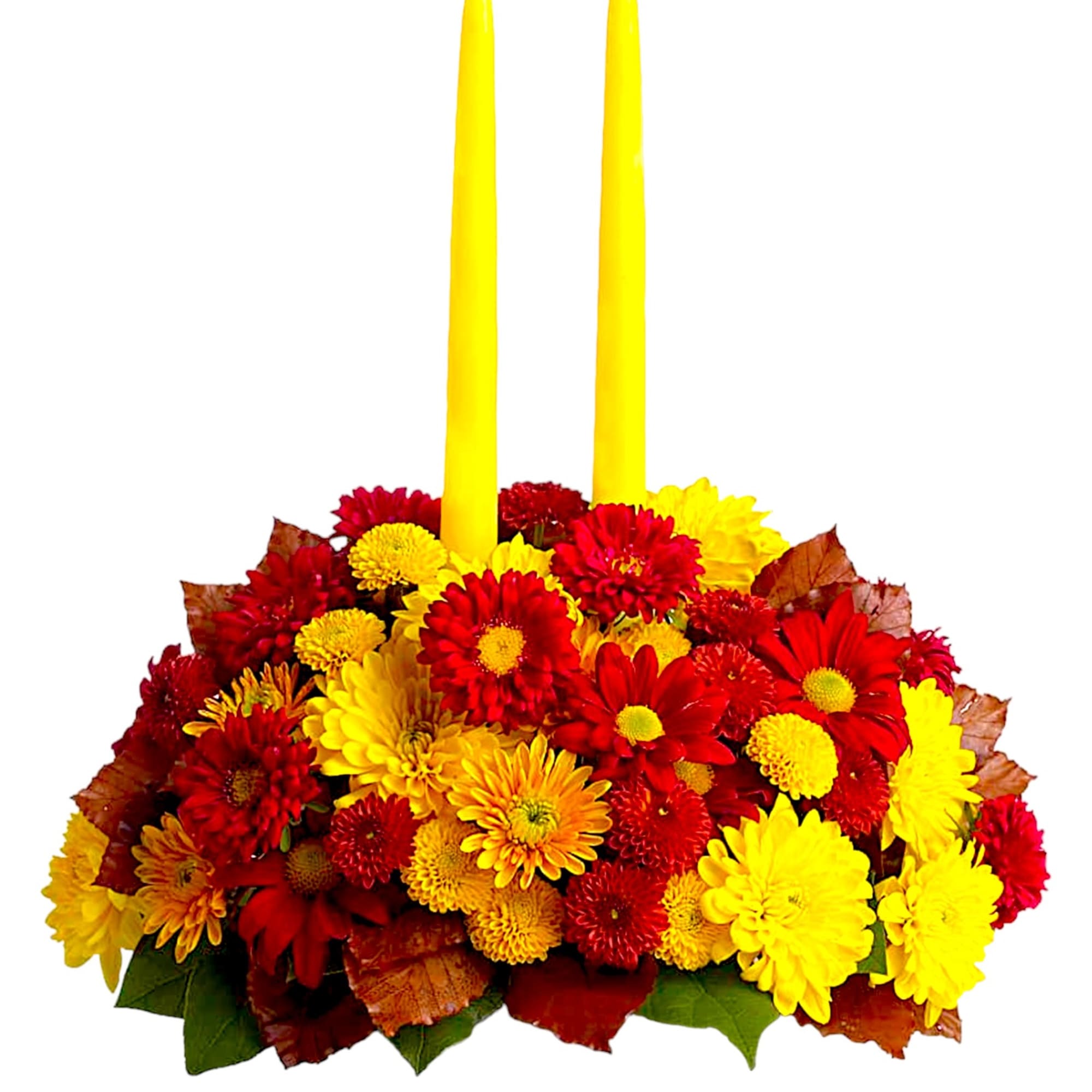Yellow candles in a red and yellow chrysanthemum arrangement