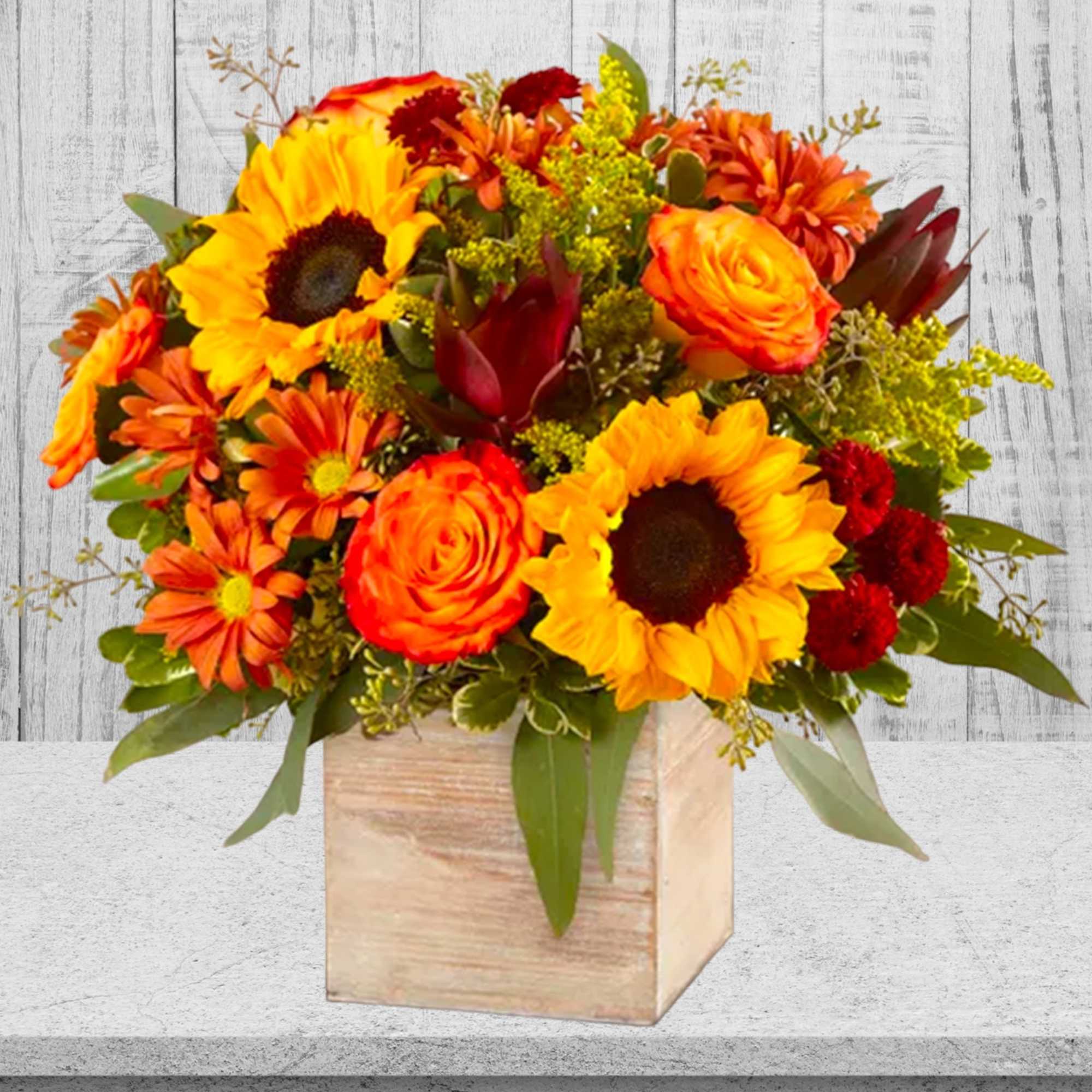 Sunflower and orange rose arrangement in a wooden cube vase, photo 3 of 3