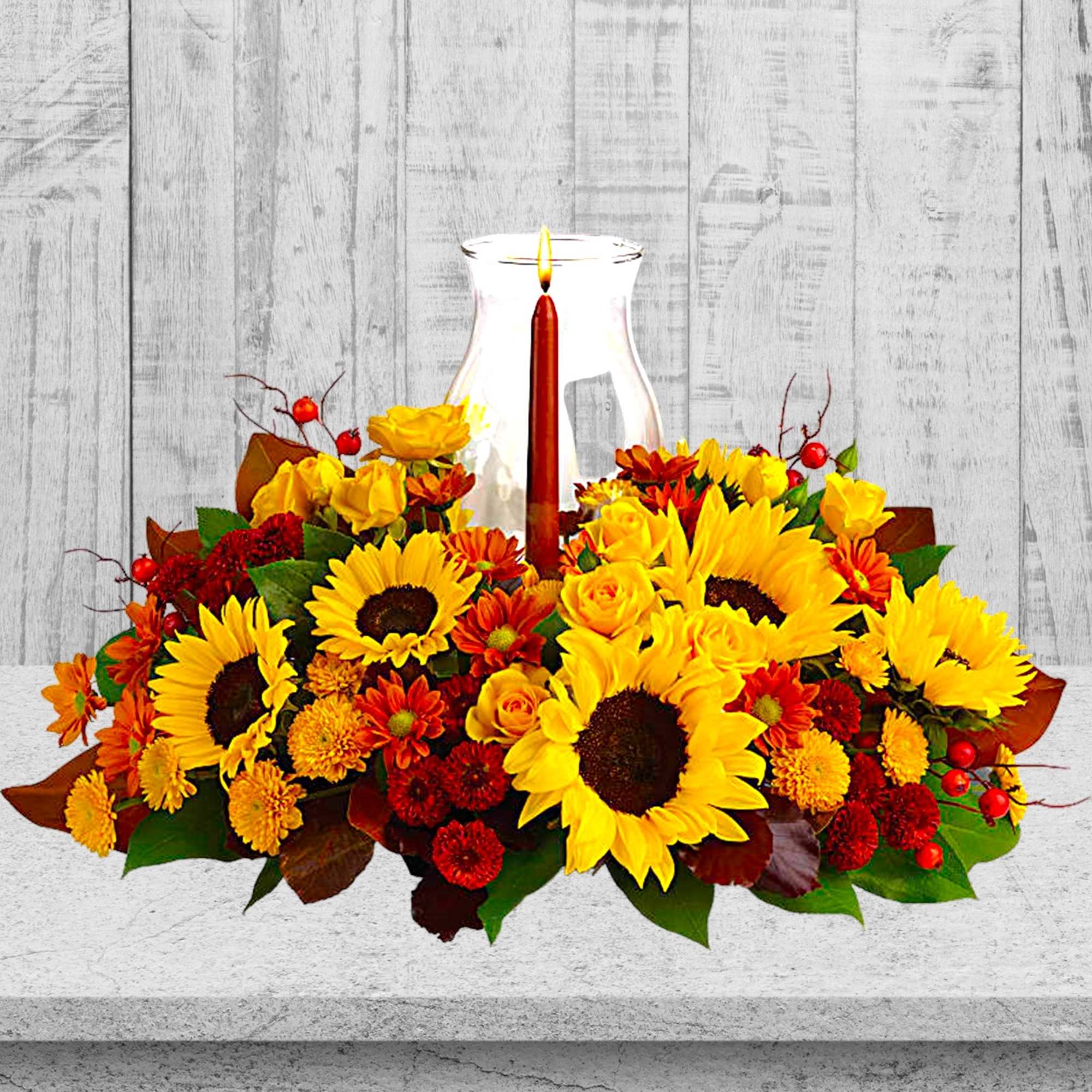 Sunflower and rose centerpiece with a lit candle in a glass hurricane, photo 2 of 4