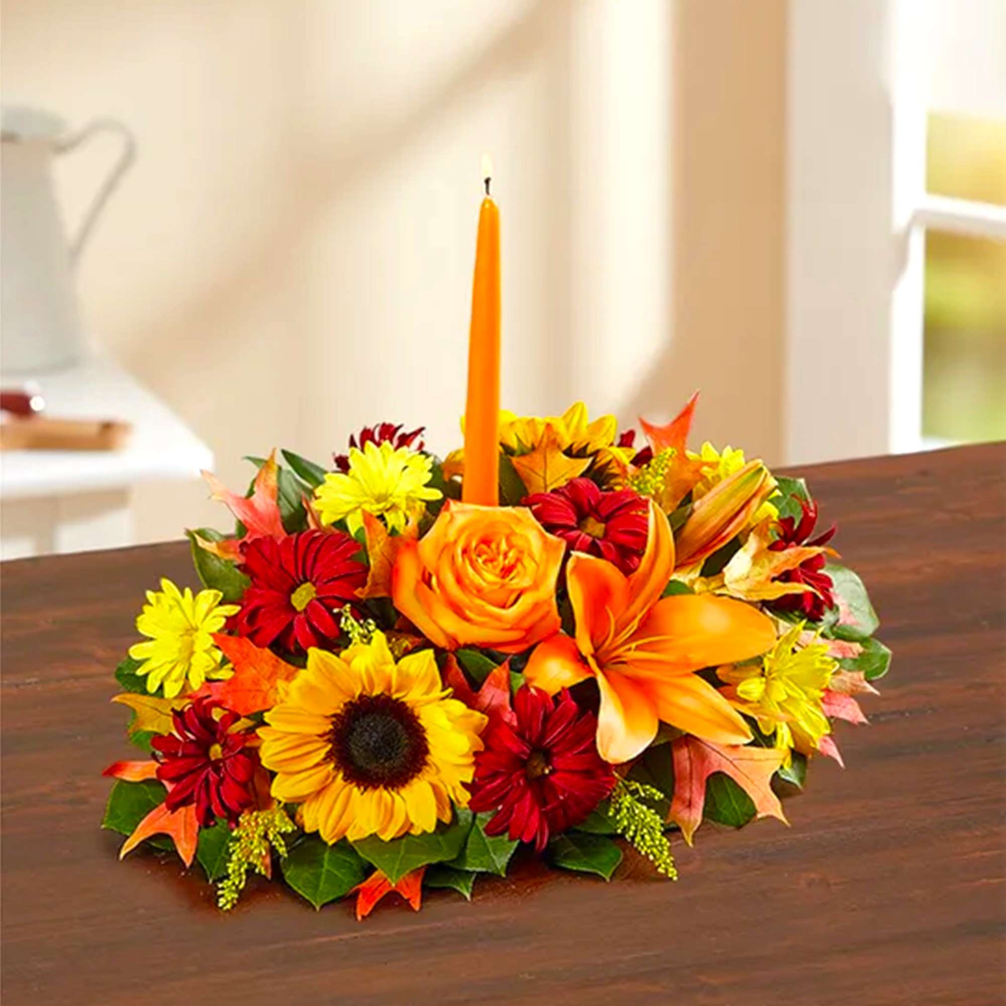 Autumn floral centerpiece with a tall orange candle, photo 3 of 5