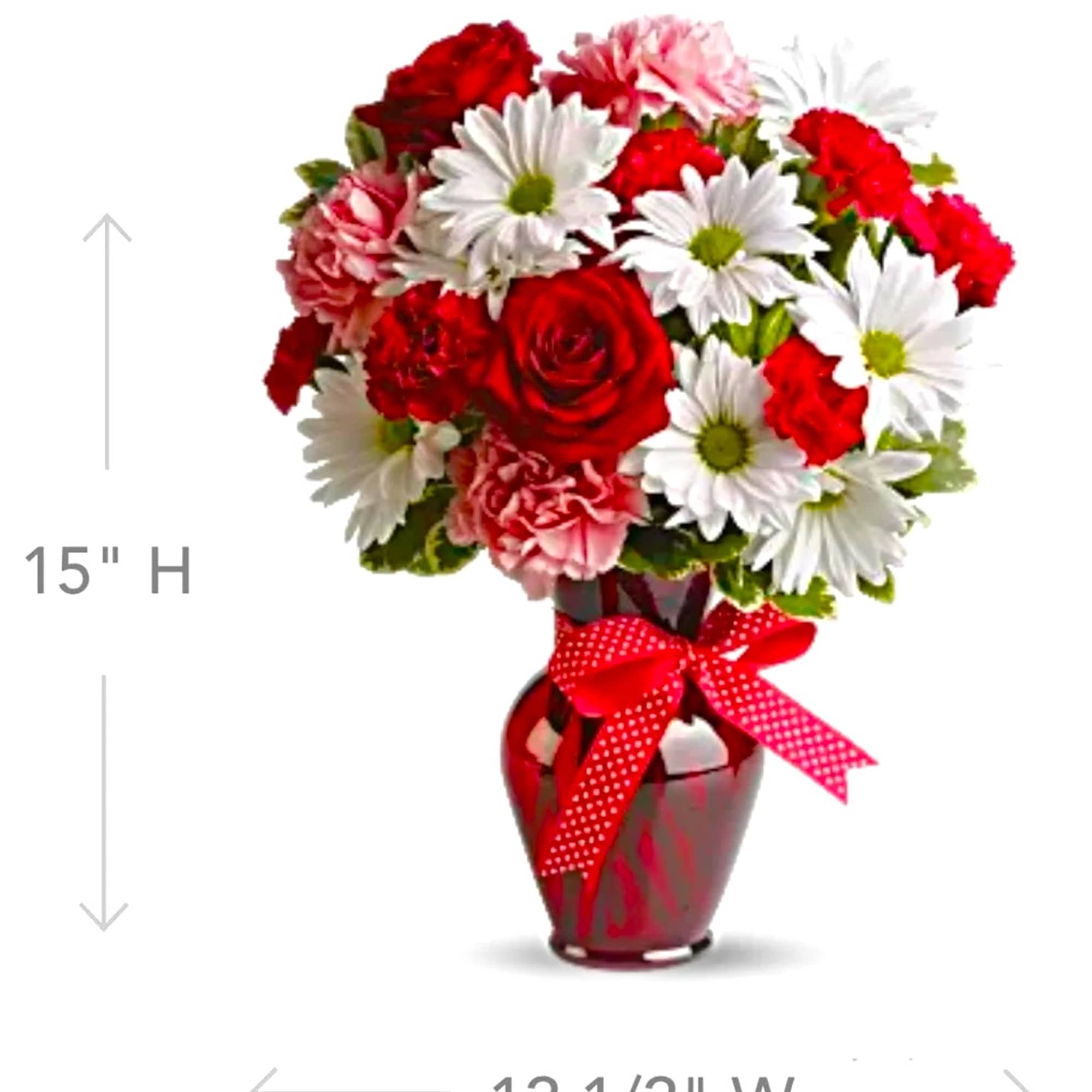 Red and white mixed bouquet in a red vase with a ribbon