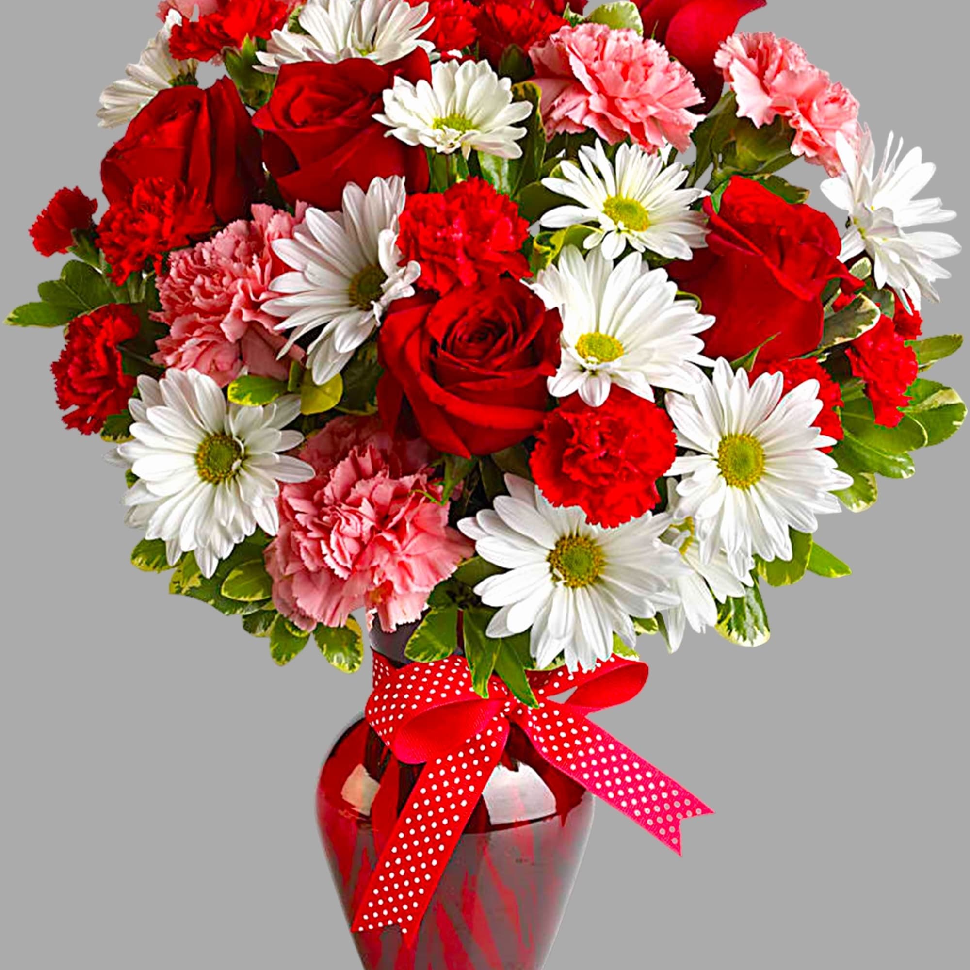 Red roses, white daisies, and pink carnations in a red vase with a polka-dot ribbon, photo 5 of 5